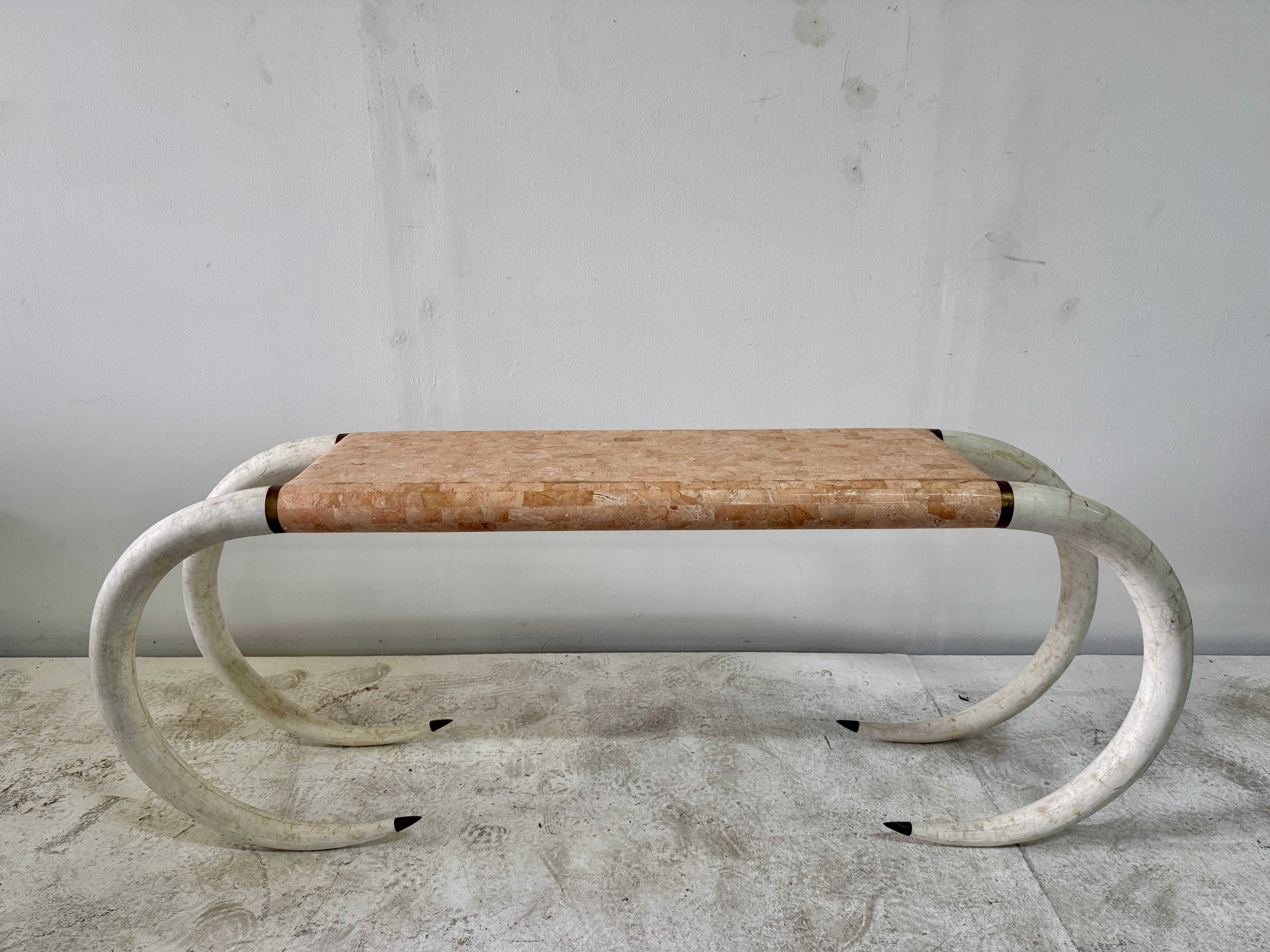 Hand Made Tessellated Stone with Elephant Tusk Leg Console Table. Made in the 1970s this piece was created in the Philippines and directly imported by Maitland-Smith, tag on the under side of table top. Nice harmonic cream tusk shaped legs with