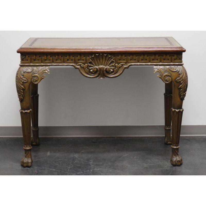A Georgian style console table by Maitland-Smith. Made in the Philippines in the late 20th Century. Painted wood, tooled leather top, carved center shell, carved ancathus knees, column legs and hairy paw feet.

Measures: 46.75 W 20.25 D 36