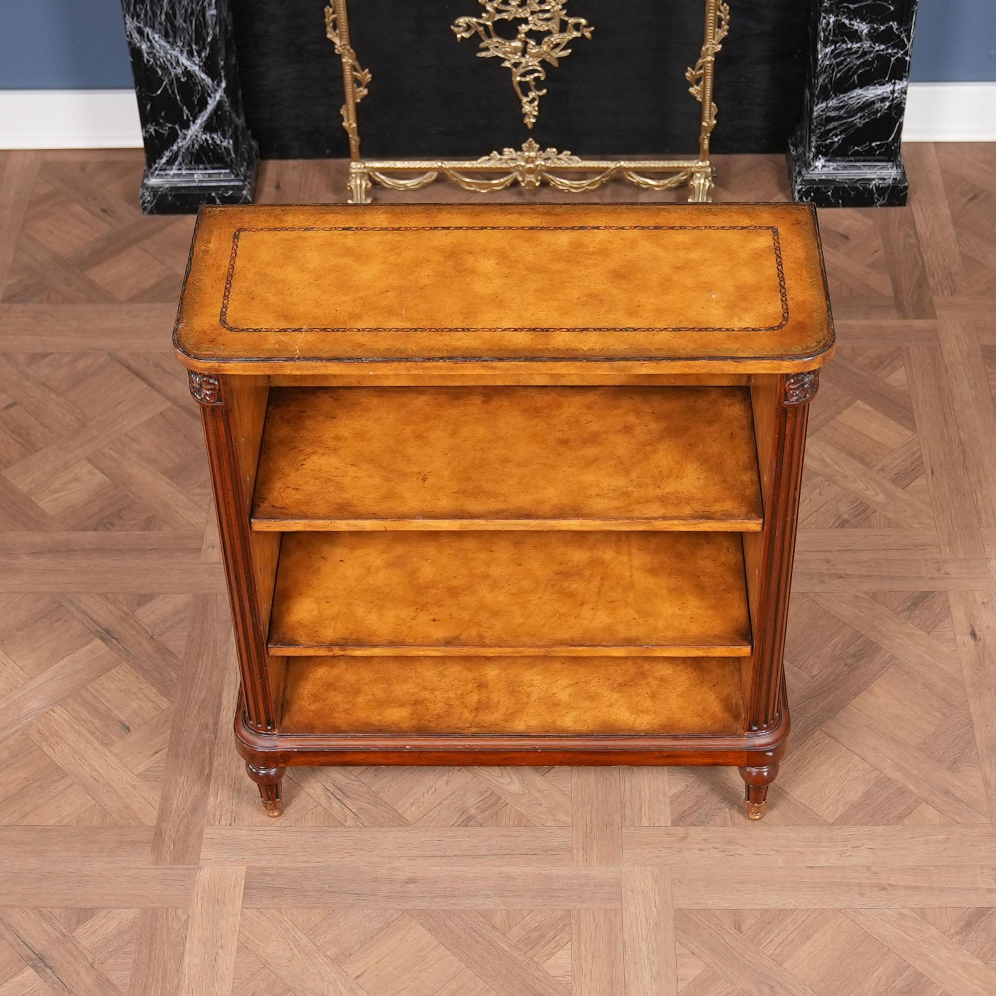 From Niagara Furniture, a Vintage Maitland Smith Leather Bookcase in excellent condition, featuring a remarkably tooled leather wrap surrounding the entire piece. Both elegant and incredibly detailed this beautiful Vintage Maitland Smith Leather