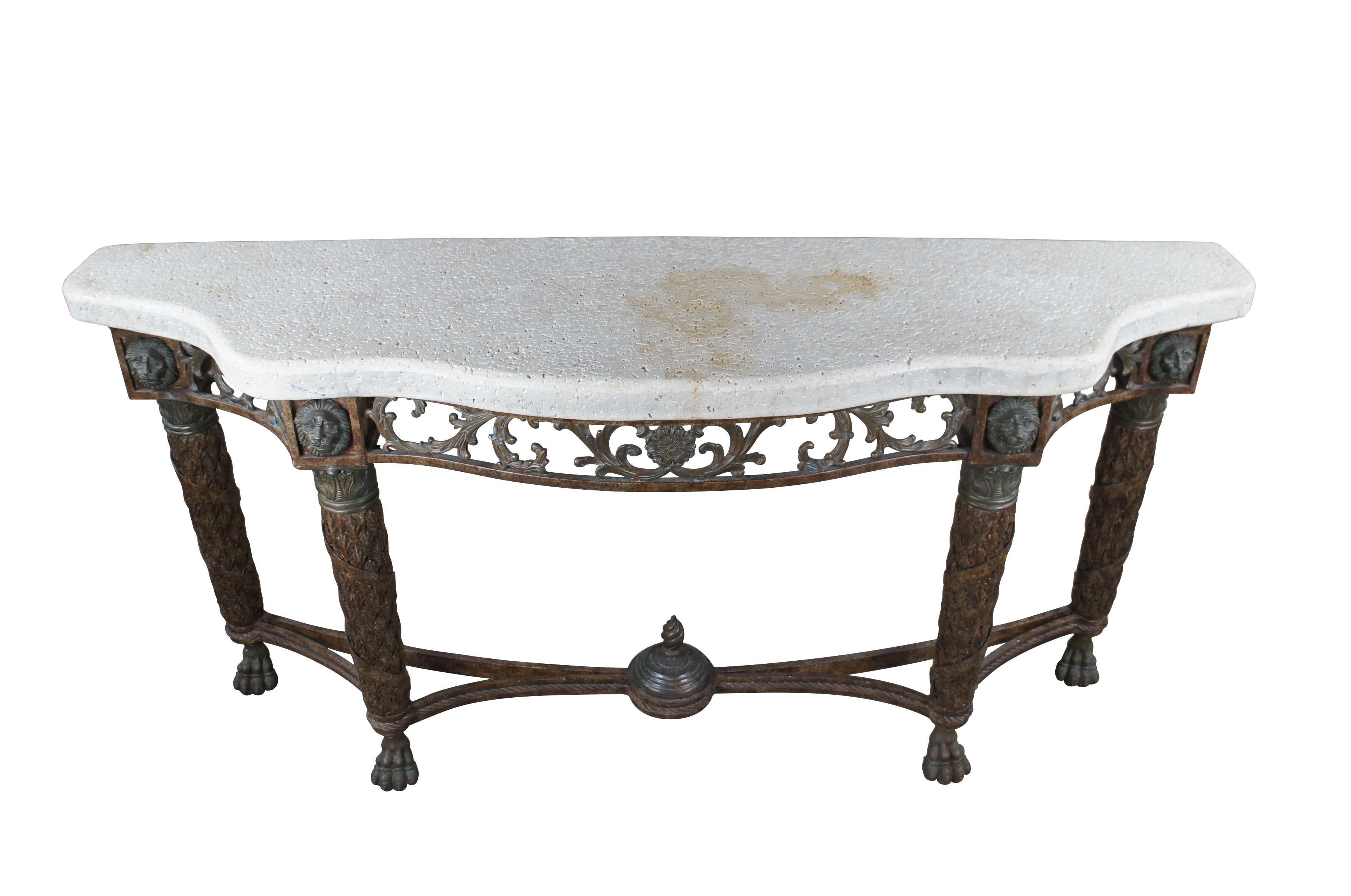An exceptional late 20th century French Louis XVI inspired serpentine console table / sideboard by Maitland Smith.  Made from iron with a porous stone top.  The robust table is supported by four tapered legs, covered in acanthus leaves with twisted