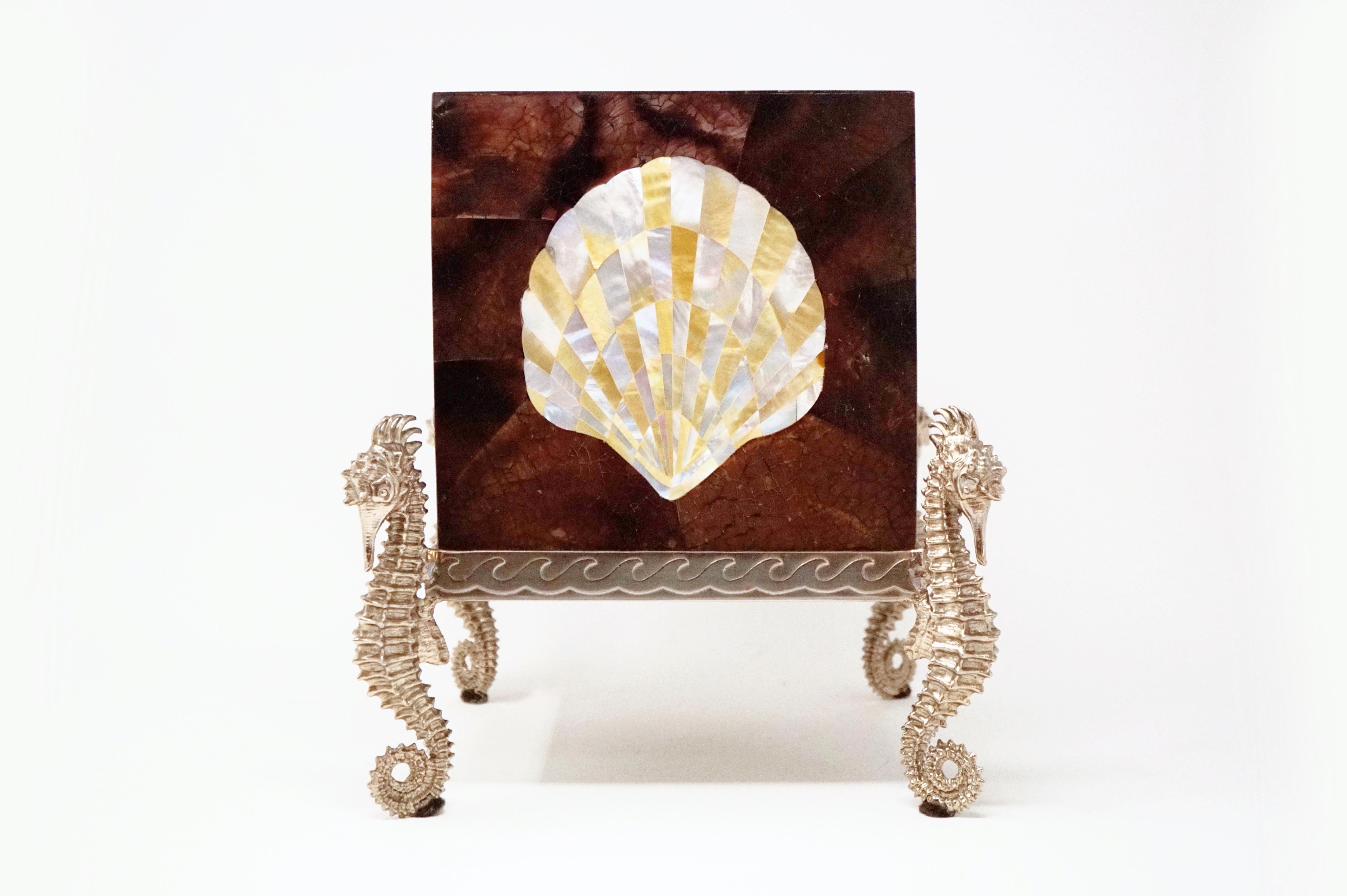- Fits standard size cube Kleenex box
- Tessellated shell and mother of pearl cladding
- Lacquered wood interior
- Silver tone metal base
- By Maitland Smith (signed on bottom)
- Made in the Philippines
- Good vintage condition
- Measures: