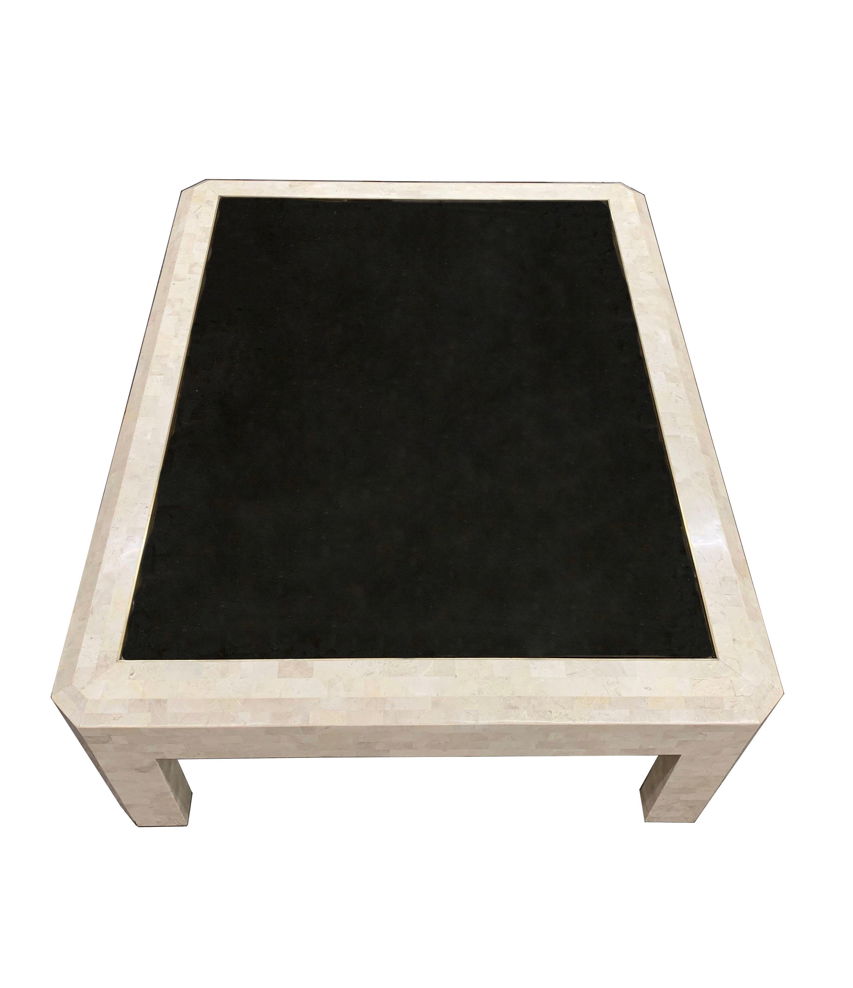 Maitland Smith Tessellated Stone Coffee Table.
A strong form in the Manner of Karl Springer.

Tinted Black Glass shown is no longer with the item. It showed to much wear. Requires a new piece of glass to be cut for the form. Clear would also look
