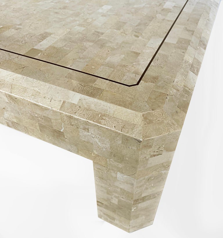 Vintage Maitland-Smith Tessellated stone coffee table with brass trim

Offered for sale is a square midcentury tessellated stone coffee table with inset brass trim by Maitland-Smith. The table has beveled edges and blunted angular corners. The