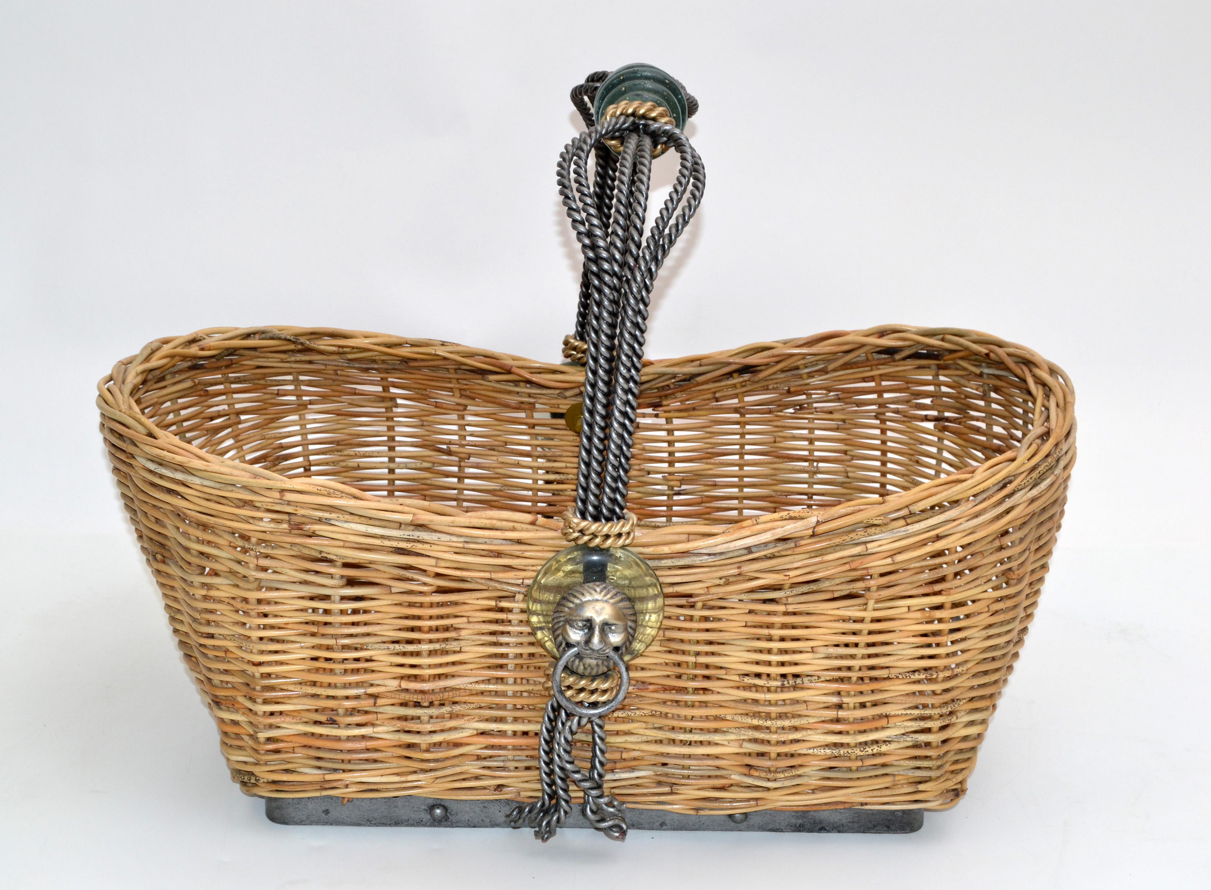 Vintage handmade Maitland Smith Basket made out of hand-woven ficks reed, wrought iron & glass handle. Brass lion head decoration on both sides.
The basket has a large storage space for magazine's, books or newspaper and looks stunning beside your