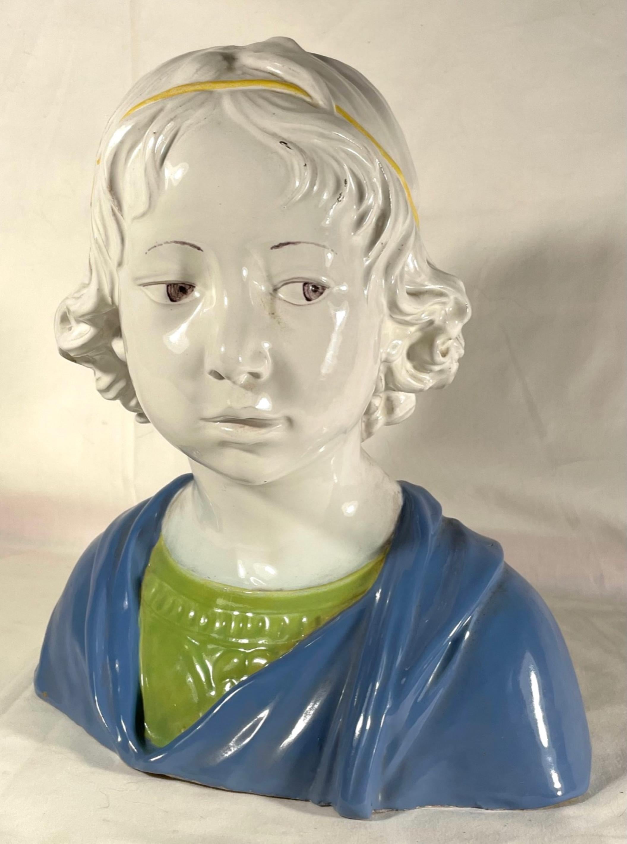 Vintage majolica bust of a young boy after Della Robbia

This glazed terracotta bust is after a work by Luca della Robbia, (1475-80) and was originally produced in Florence during the height of the Italian Renaissance. It is exhibited in the