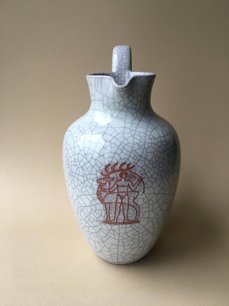 This ceramic jar is manufactured using crackle glaze technique. Its color is light grey with burgundy image on it.