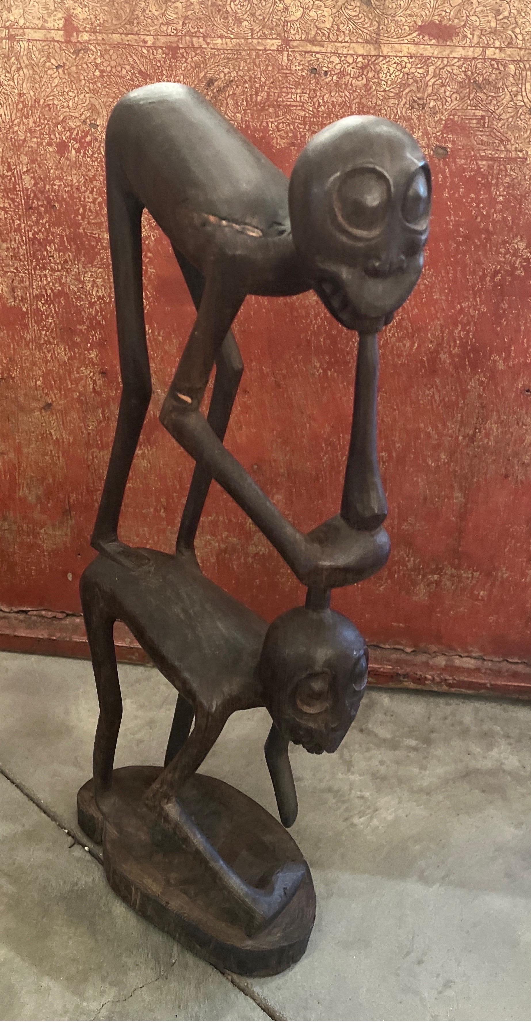 Sculpted by an artist of the highest skill, this Makonde carving from Tanzania is a brilliant and graceful  image of two figures.  Made out of heavy and dense African blackwood,  this is an example of the very best Makonde sculpture.  Striking in