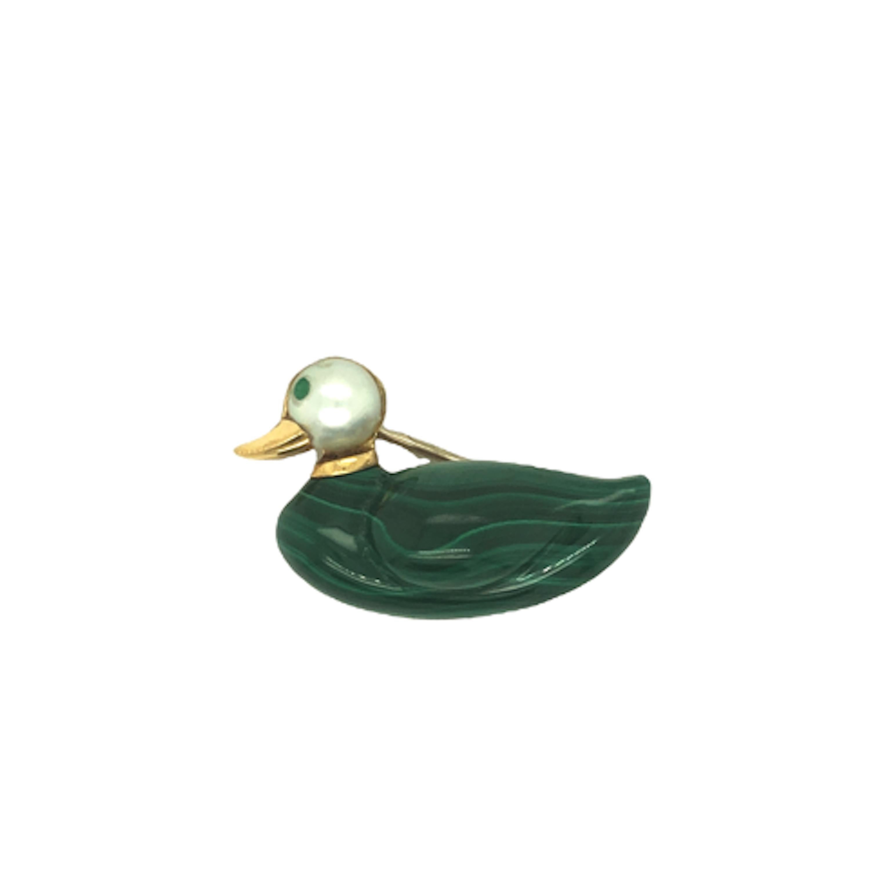 It’s a duck and a delightful one at that! This congenial duck brooch features a carved malachite body, a cultured pearl head, emerald eye and a shiny gold bill.  Crafted in 18 karat yellow gold and stamped 750. The brooch measures is .75 inch x 1.25