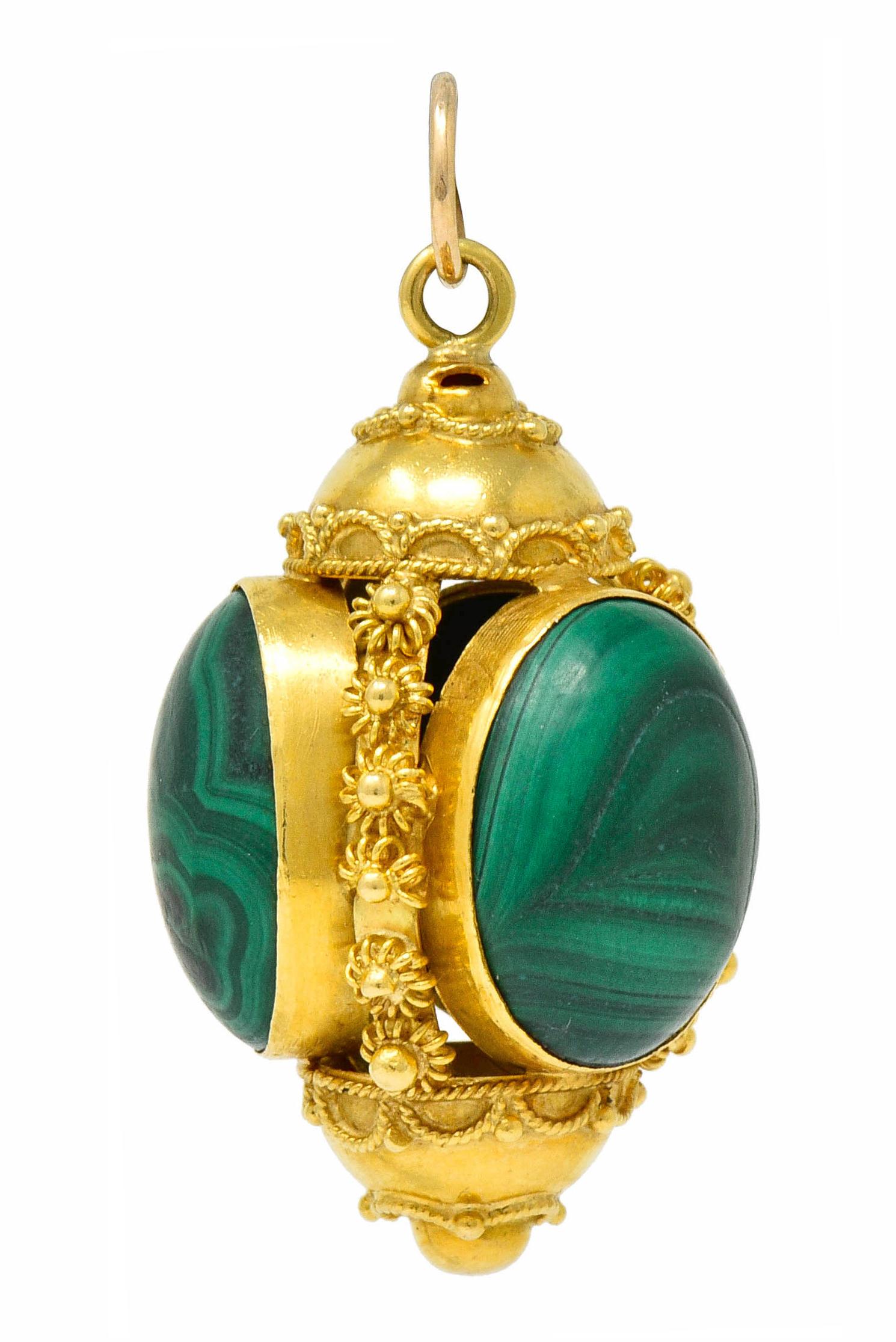 Pendant is designed as a pierced egg-like form that is decorated throughout by polished gold beads, caged florals, and a draped twisted rope motif

Featuring four oval malachite cabochons, bezel set, measuring approximately 15.5 x 11.5 mm

Malachite