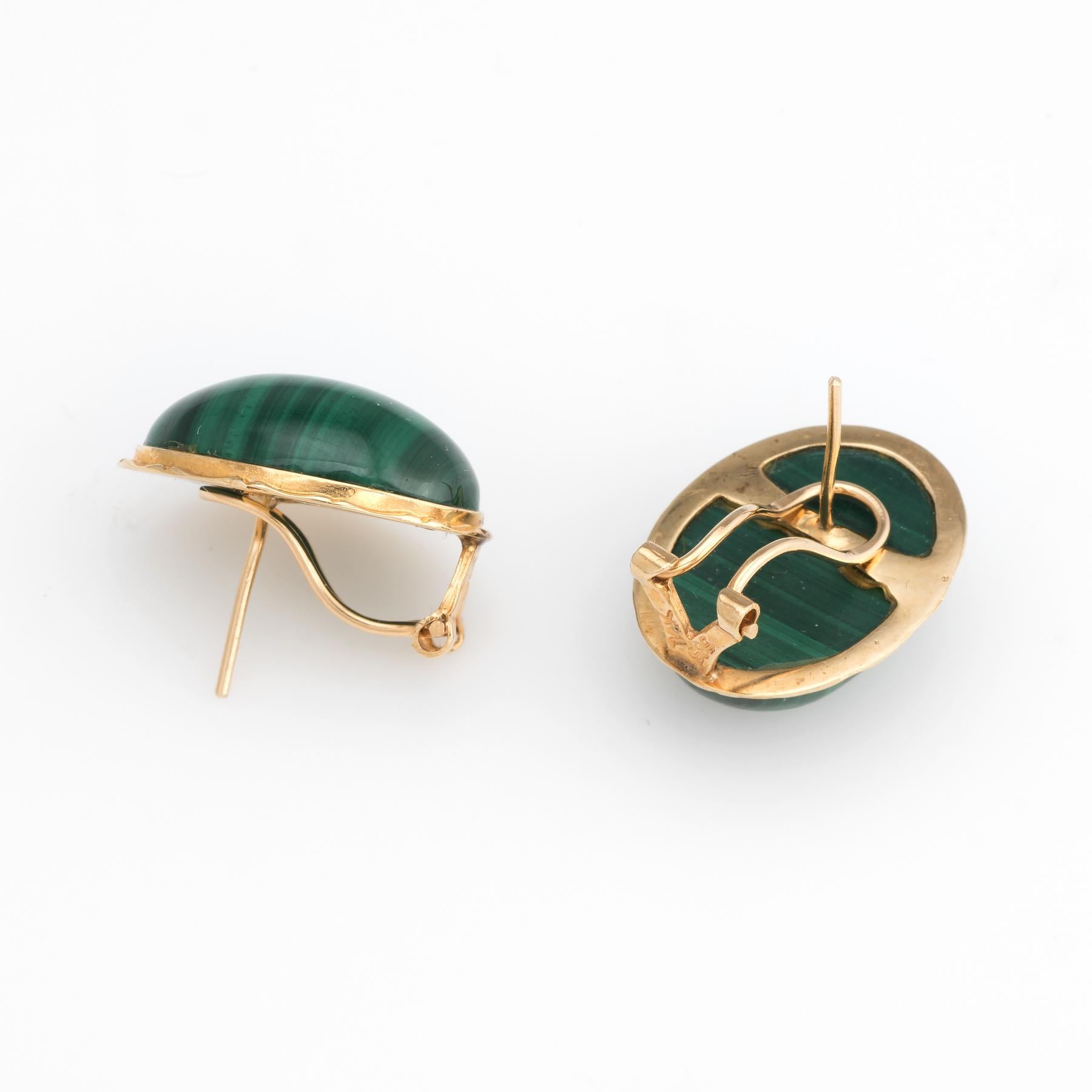 Elegant pair of vintage malachite earrings, crafted in 14k yellow gold. 

Malachite measures (each) 18mm x 12mm. The malachite is in excellent condition and free of cracks or chips. 

The malachite is securely set into bezel mounts. The earrings