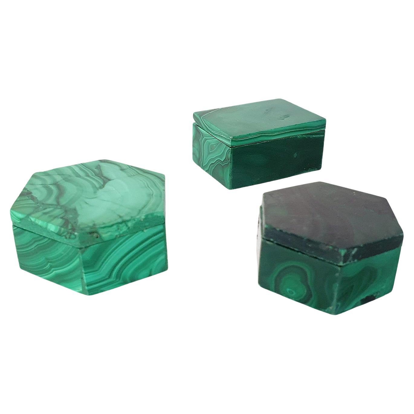 A set consisting of three handmade miniature boxes of malachite originating from Congo, Africa. Two boxes are hexagon and one is rectangular.