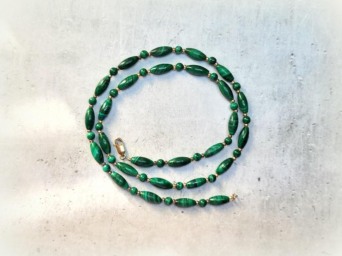 The length of the necklace is 20.5 inches (52 cm). The size of the smooth barrel beads is 12mm x 5mm, and the size of the small round beads is 4mm.
The color of the beads varies from deep dark green to light green shades. In addition, the color