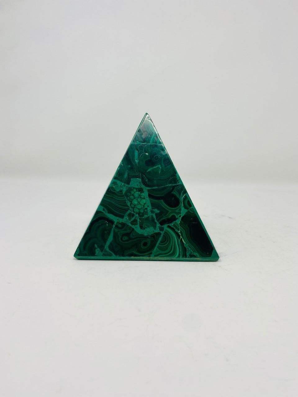 Striking green malachite paneled veneer pyramid. This beautiful and interesting vintage piece will add style to your décor. Whether a Mid Century purist or a stylish addition to your eclectic décor, this beautiful pyramid piece will add style and