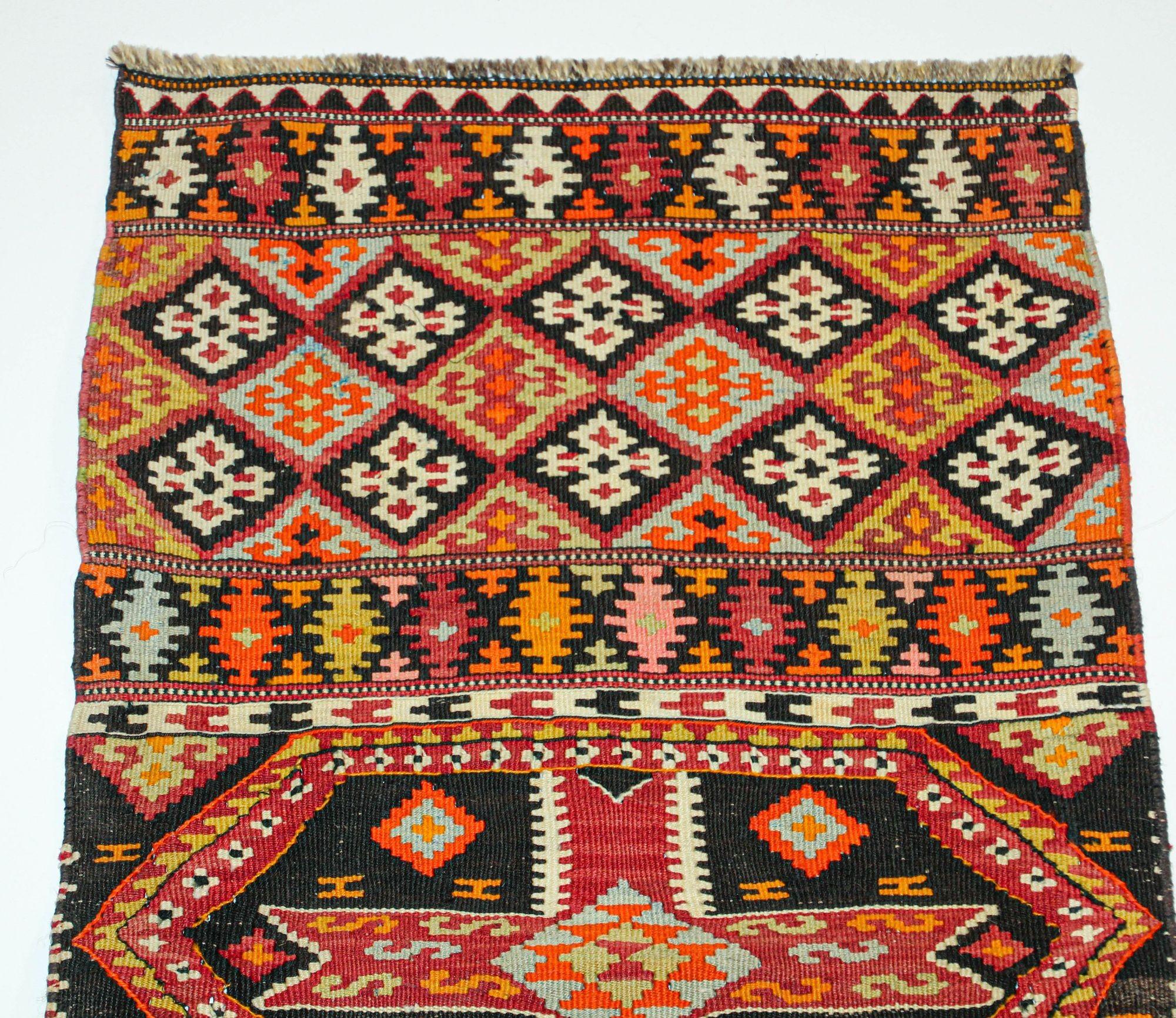 Vintage Malatya Kilim South Anatolia Nomadic Rug Turkish Carpet.
Southern Anatolian Antique Kilim from the Malatya region with a rare and beautiful color composition. 
The brocaded bands cross the entire width of the field forming panels contained