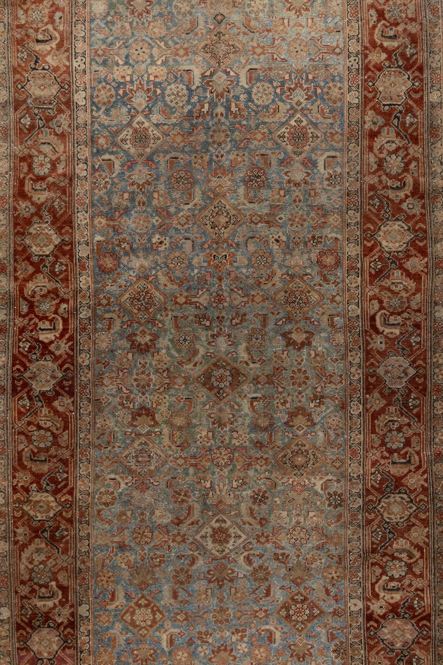 Experience the grace and charm of classic Persian elegance with this exquisite Vintage Malayer Gallery Rug. Handcrafted with the finest wool, the warm, time-softened colors of this luxurious piece will evoke a welcoming atmosphere of sophistication