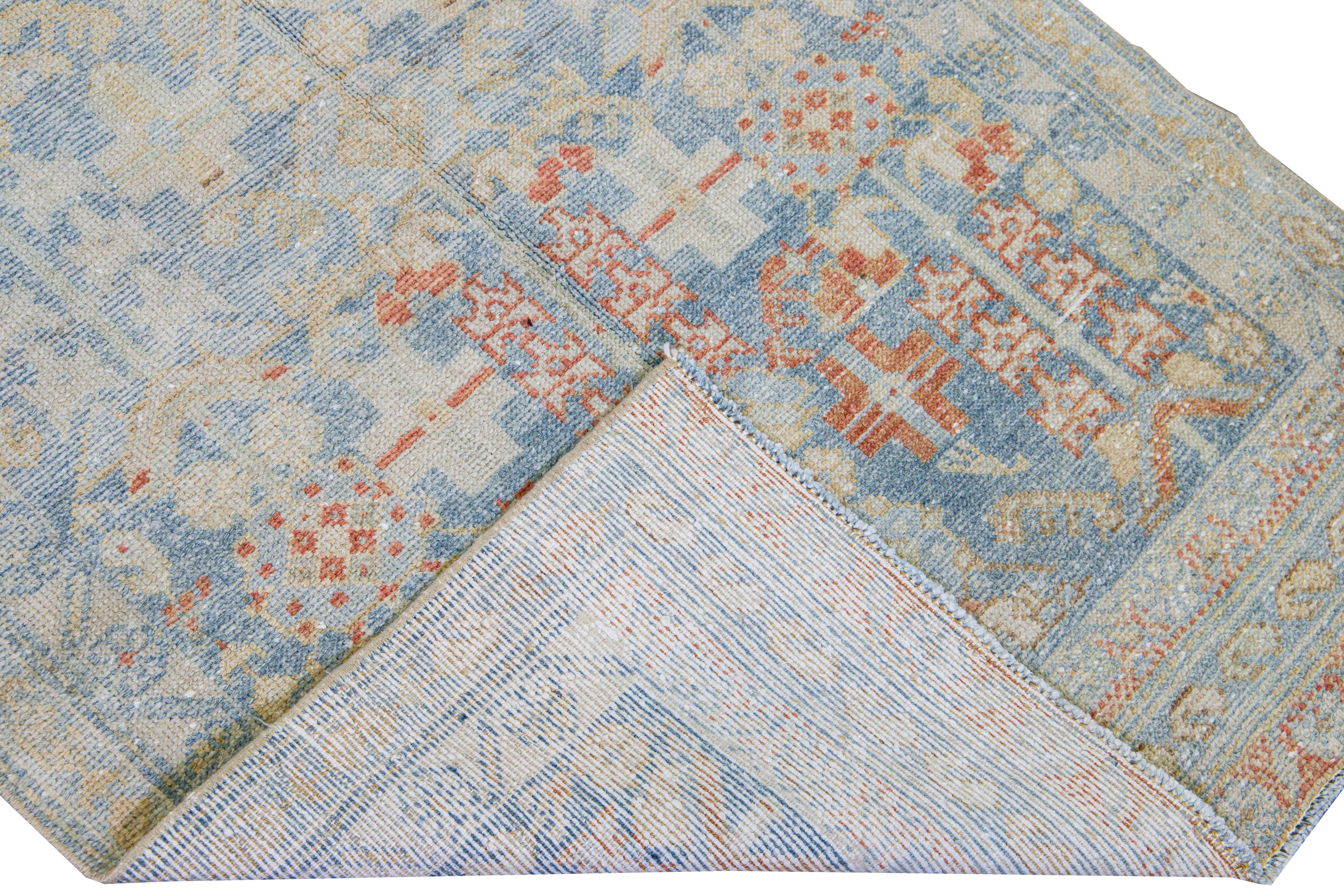 Beautiful vintage Malayer hand-knotted wool runner with a blue field. This Malayer rug has a beige frame and accents of rust in an all-over gorgeous geometric medallion floral pattern design.

This rug measures: 3' x 13'1