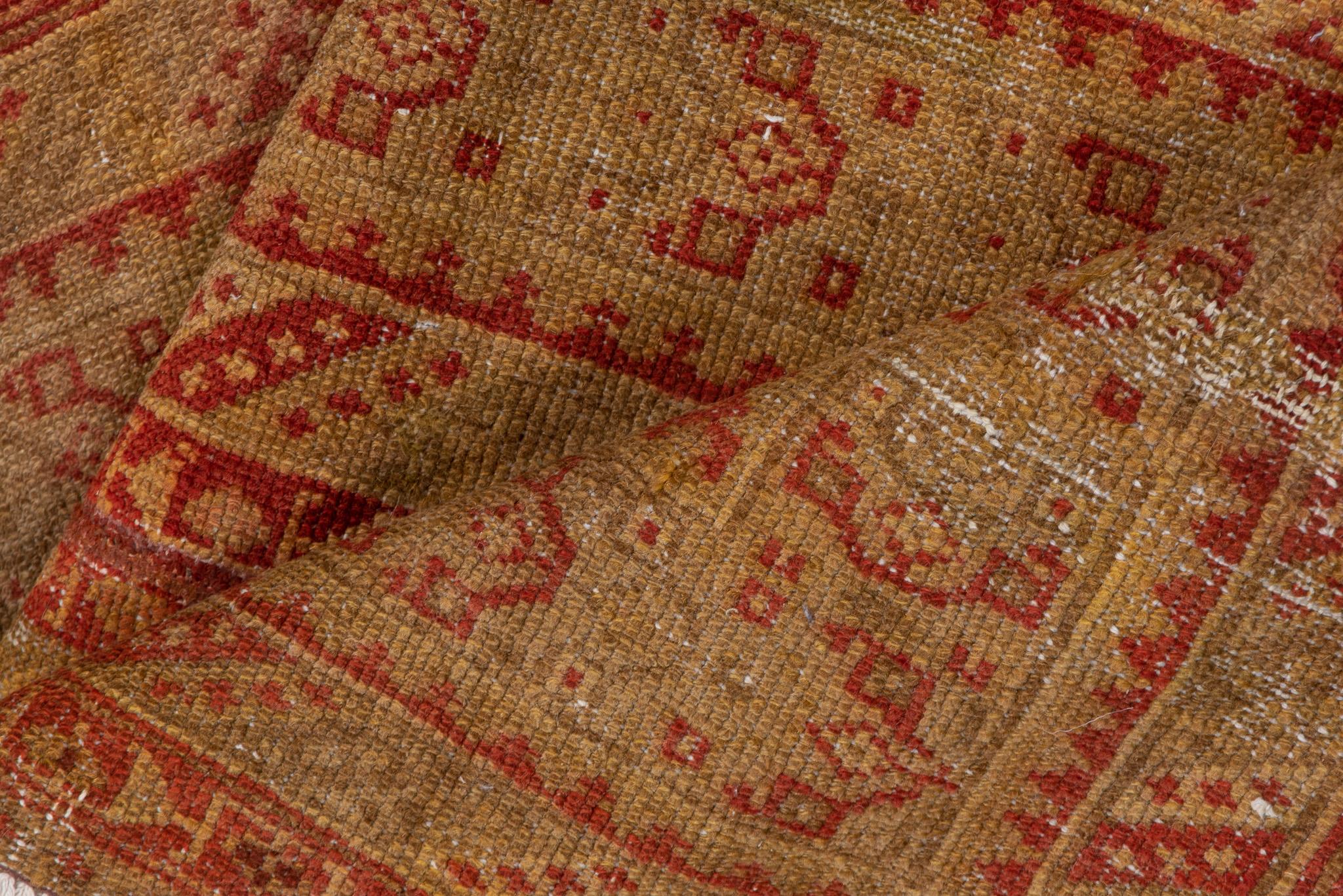 This is a graceful Malayer runner measuring 2.1 x 6.7 feet. It features a subtle and elegant geometric pattern in warm shades of red and beige, creating a balanced and understated aesthetic. The elongated design and intricate details make it perfect