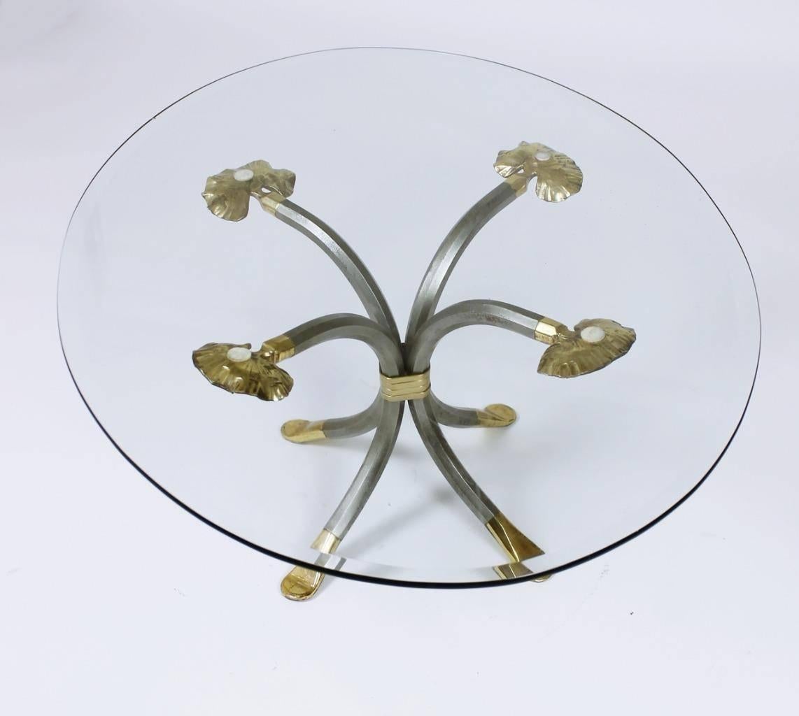 Manfred Bredohl was a leading metal designer in 1970s-1980s with significant work in Germany and United States. Four forged and faceted solid steel legs with solid brass pad feet and hand-wrought solid brass leaf design at top. Tightly wrapped