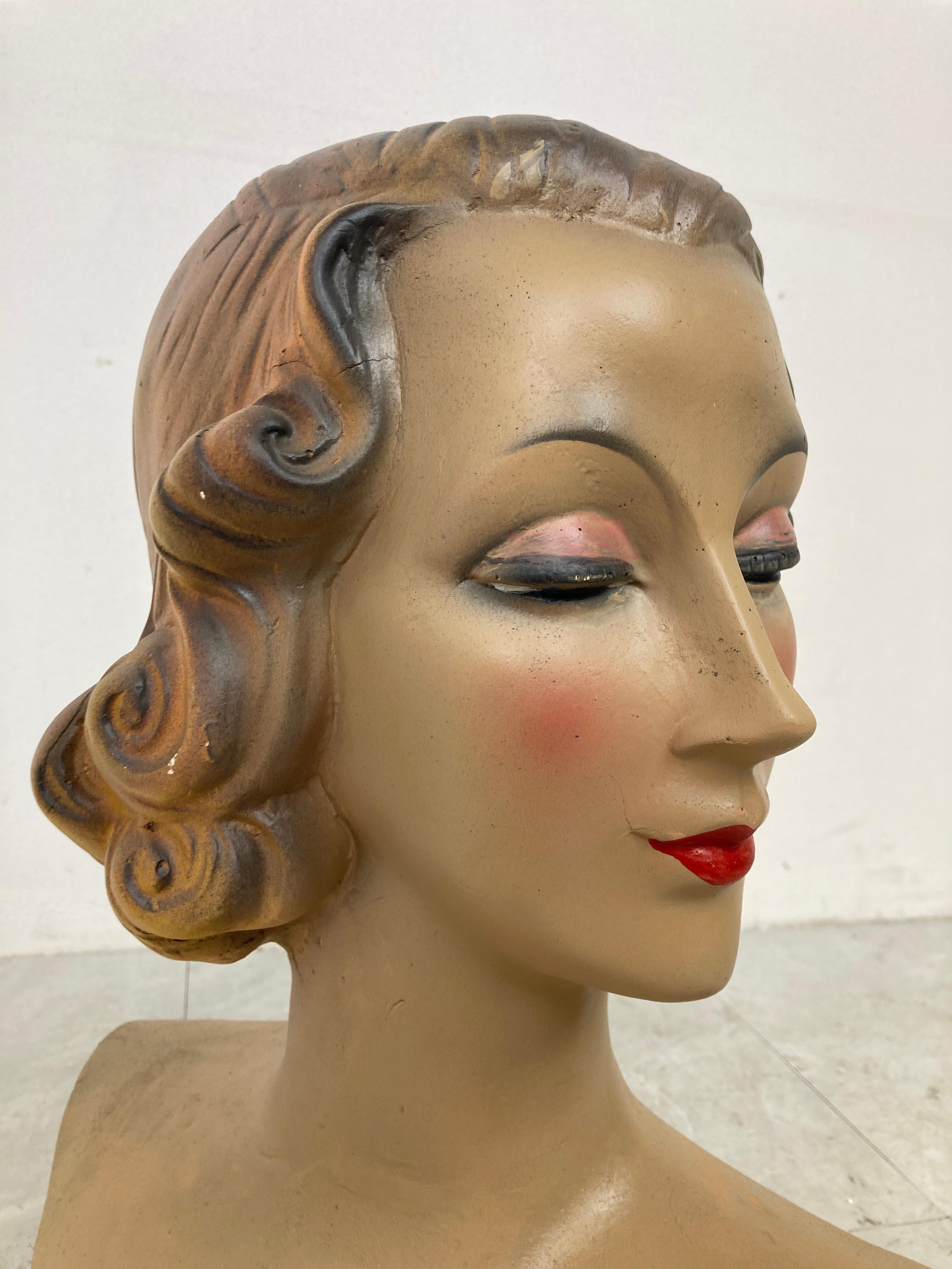 Beautiful female mannequin head made from plaster servings as an advertising bust in a shop.

It was used to be displayed at a shopcounter or vitrine.

Comes from a lot acquired from a clothes shop that stopped activities.

Great decorative