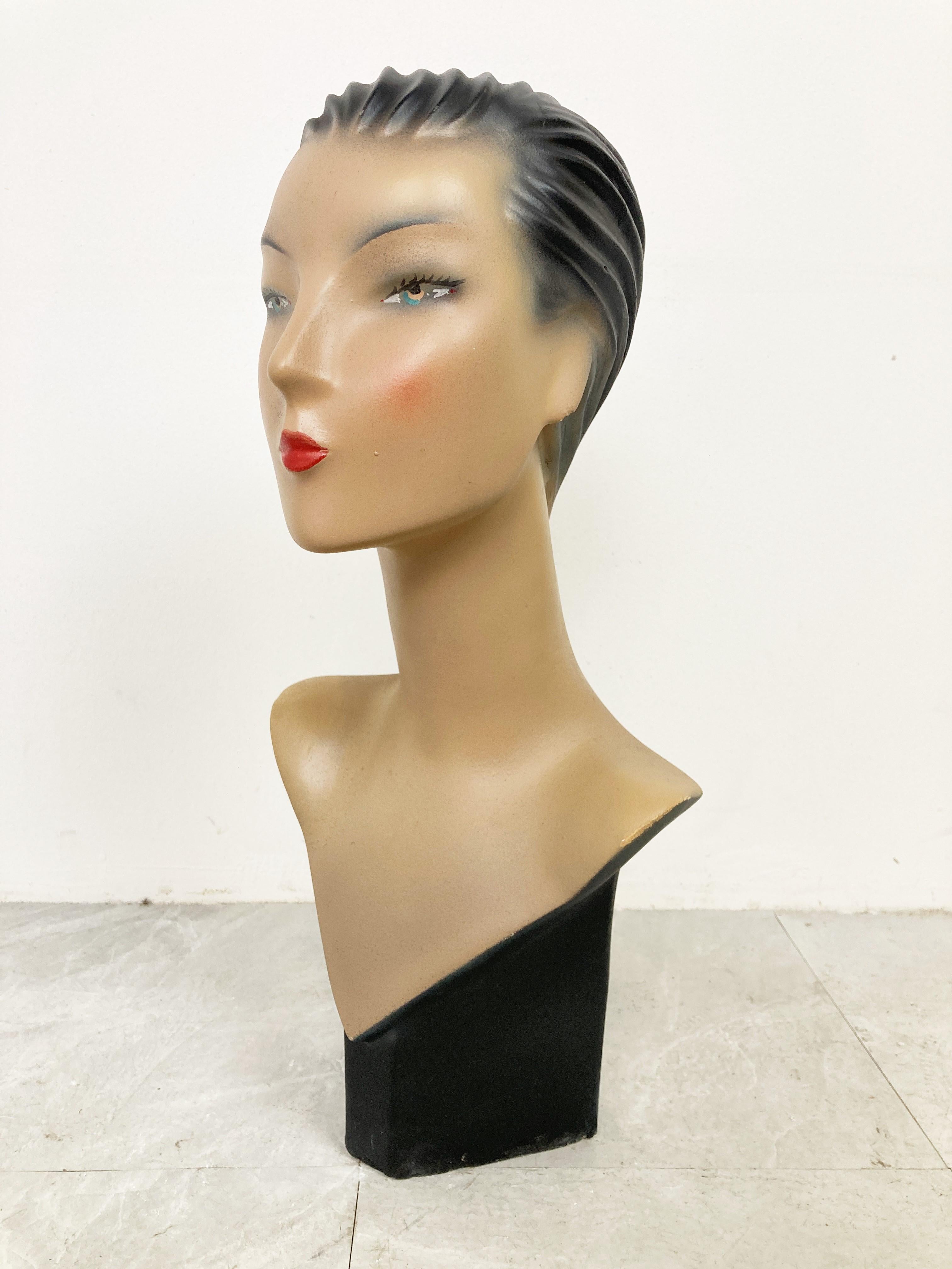 Beautiful female mannequin head made from plaster servings as an advertising bust in a shop.

It was used to be displayed at a shopcounter or vitrine.

Comes from a lot acquired from a clothes shop that stopped activities.

Great decorative item to