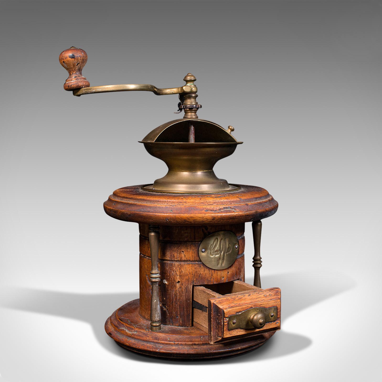 This is a vintage manual coffee grinder. A Continental, fruitwood rotary coffee bean mill, dating to the mid 20th century, circa 1940.

Wonderfully mechanical, ideal for decorative display
Presenting a desirable aged patina throughout
Fruitwood