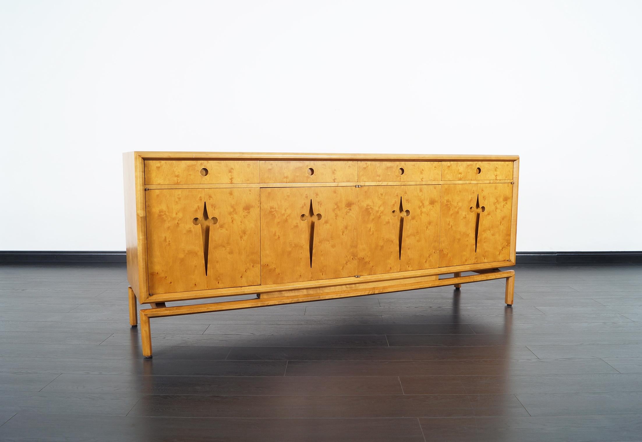 Amazing vintage maple burl credenza designed by Edmond J. Spence. Features a total of ten drawers.