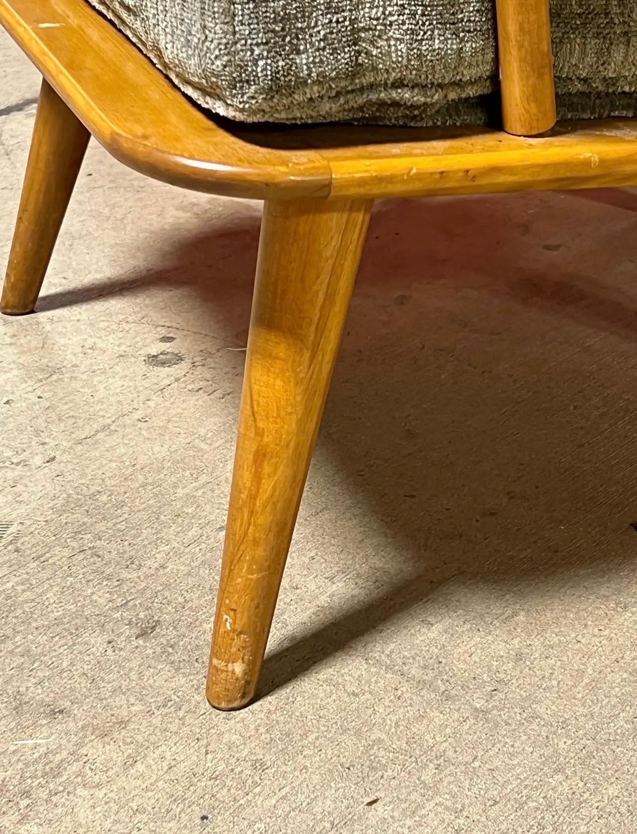 Available for purchase is a rare lounge chair crafted from beautiful maple wood, made by Conant Ball. We also have a larger version of this chair listed in the same style. Don’t miss out on this unique find! The cushion sizes are odd I’m not sure if