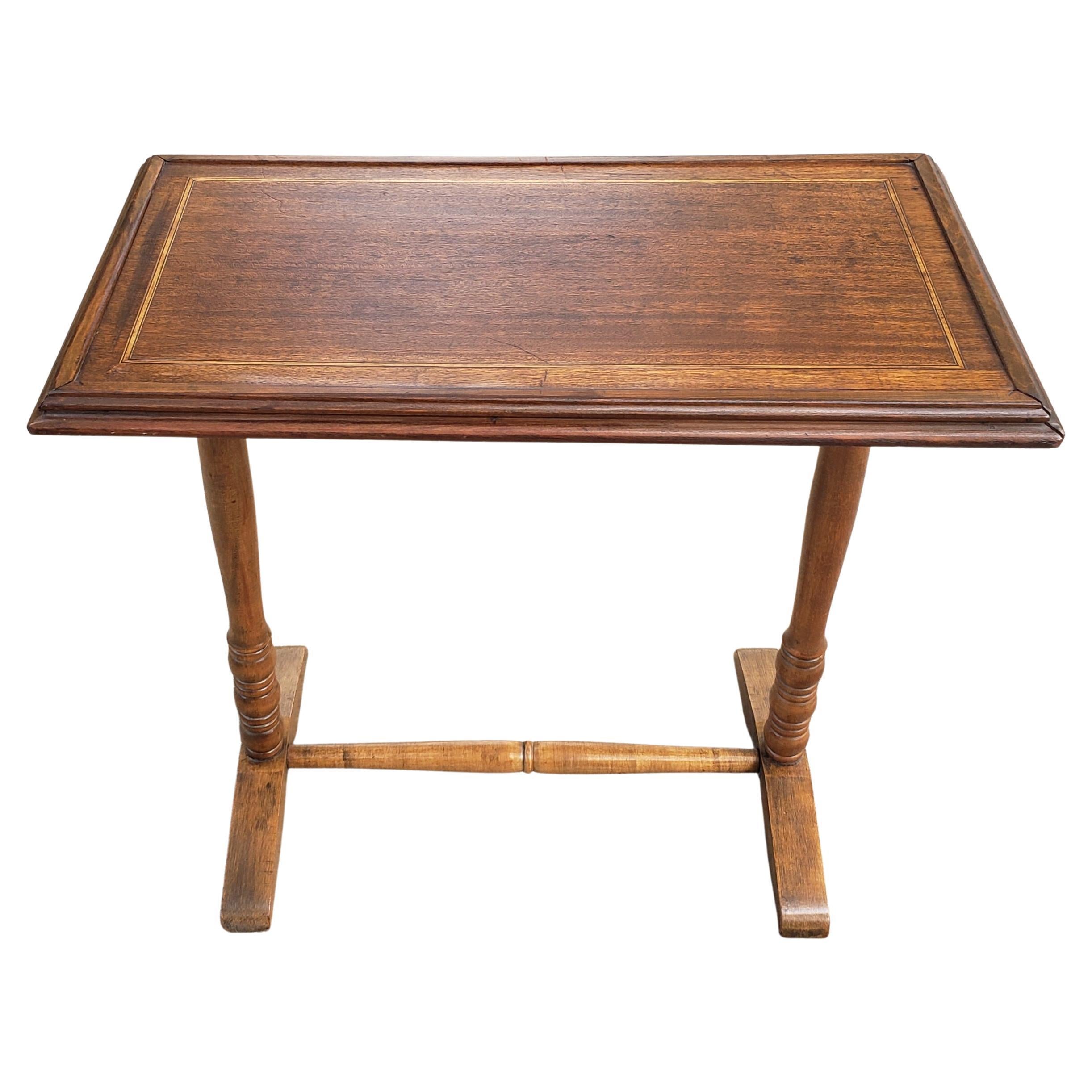 An exquisite, small mahogany top with satinwood inlays and maple legs and trestle. 
Table is sturdy and Measures 25.25