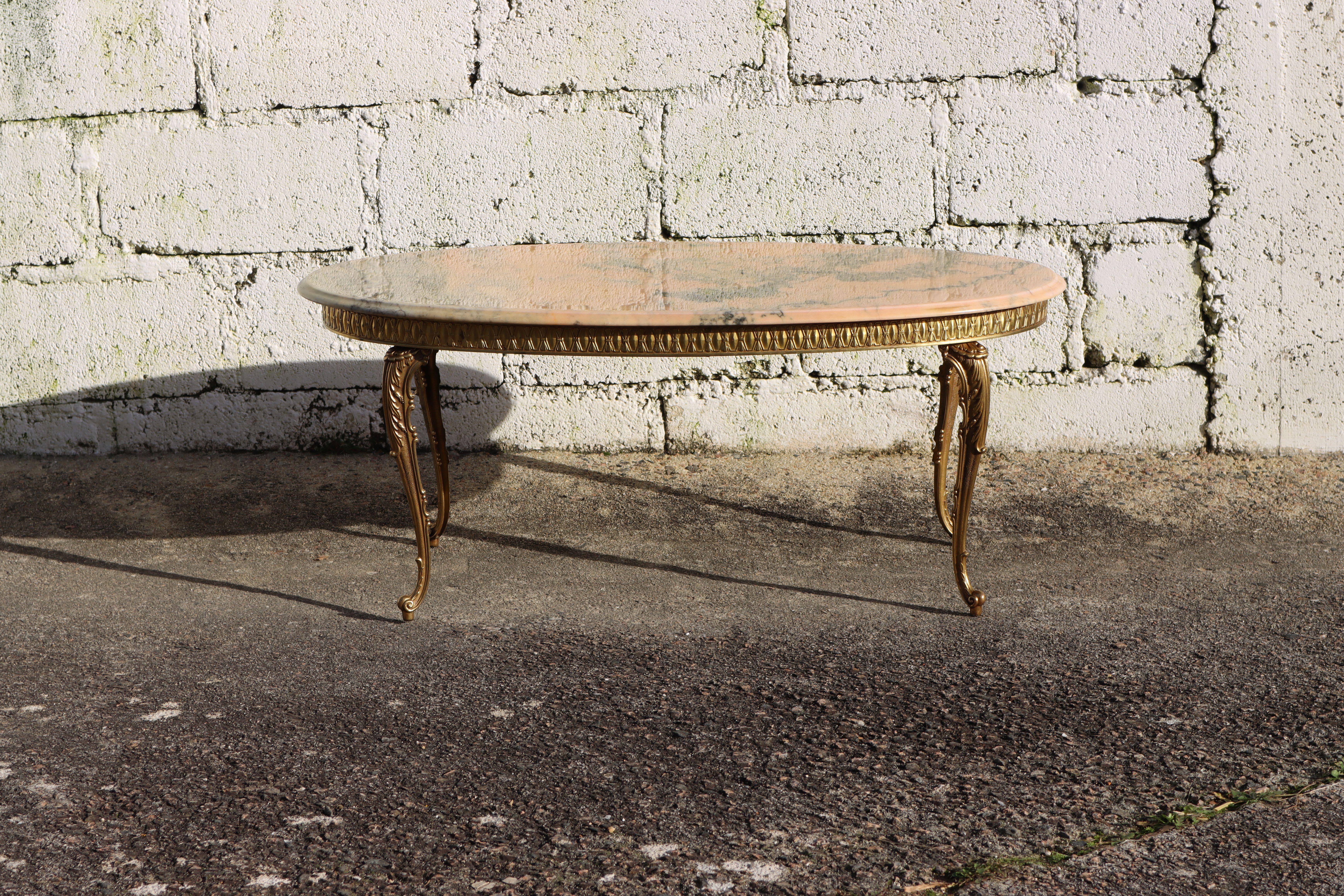 Wonderful French Vintage Marble and Brass Coffee Table - Lounge Table Style Louis XV from the 60s
Oval Marble Top all-round decorative Edge
Splendid Colors : vanilla, rose, gray, and anthracite- a real colorful spectacle
Stable and elegant richly