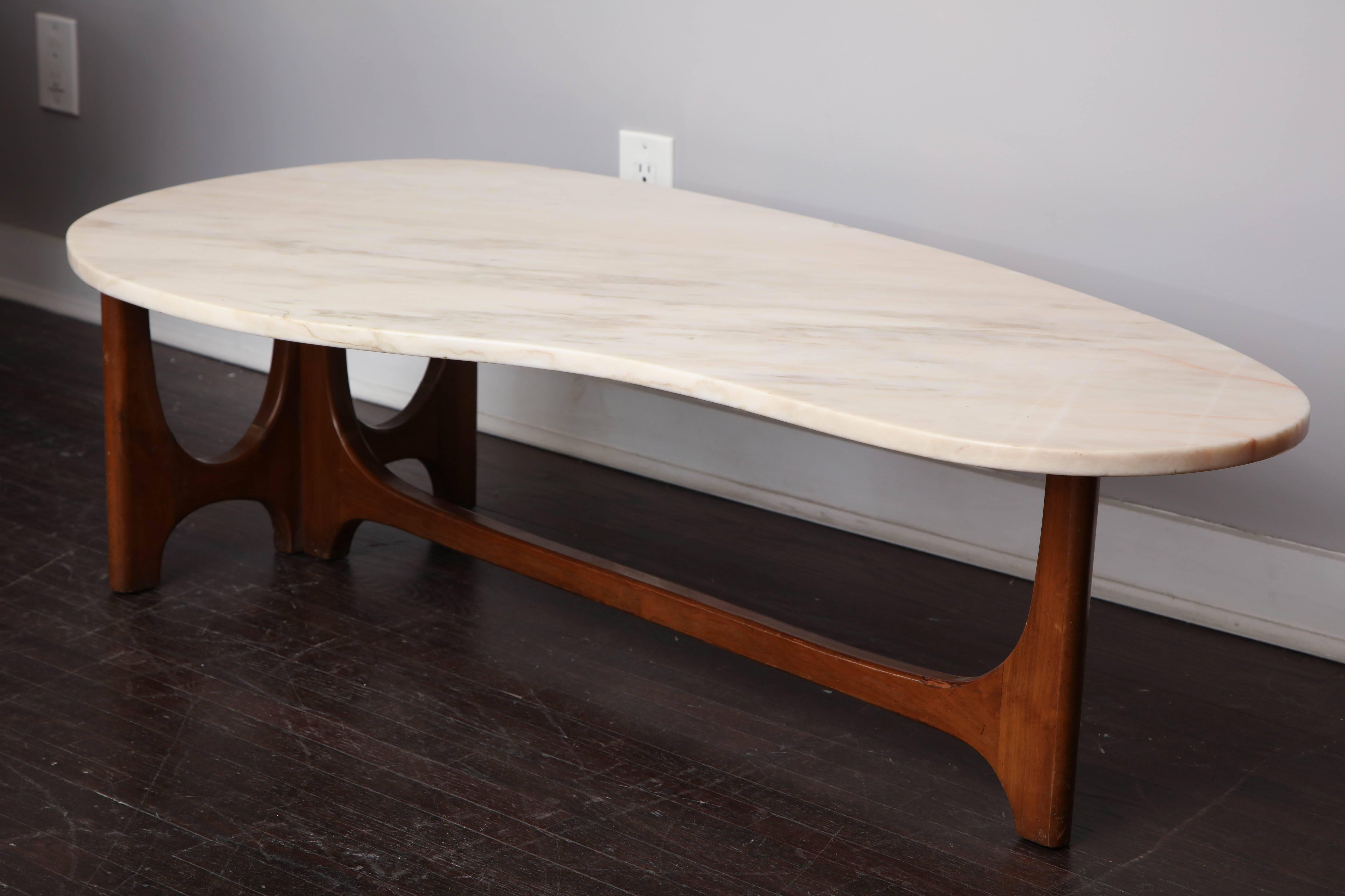 Vintage marble and walnut coffee table in the manner of Harve Probber. There are some minor blemishes such as nicks on the marble. This table is sold as is.