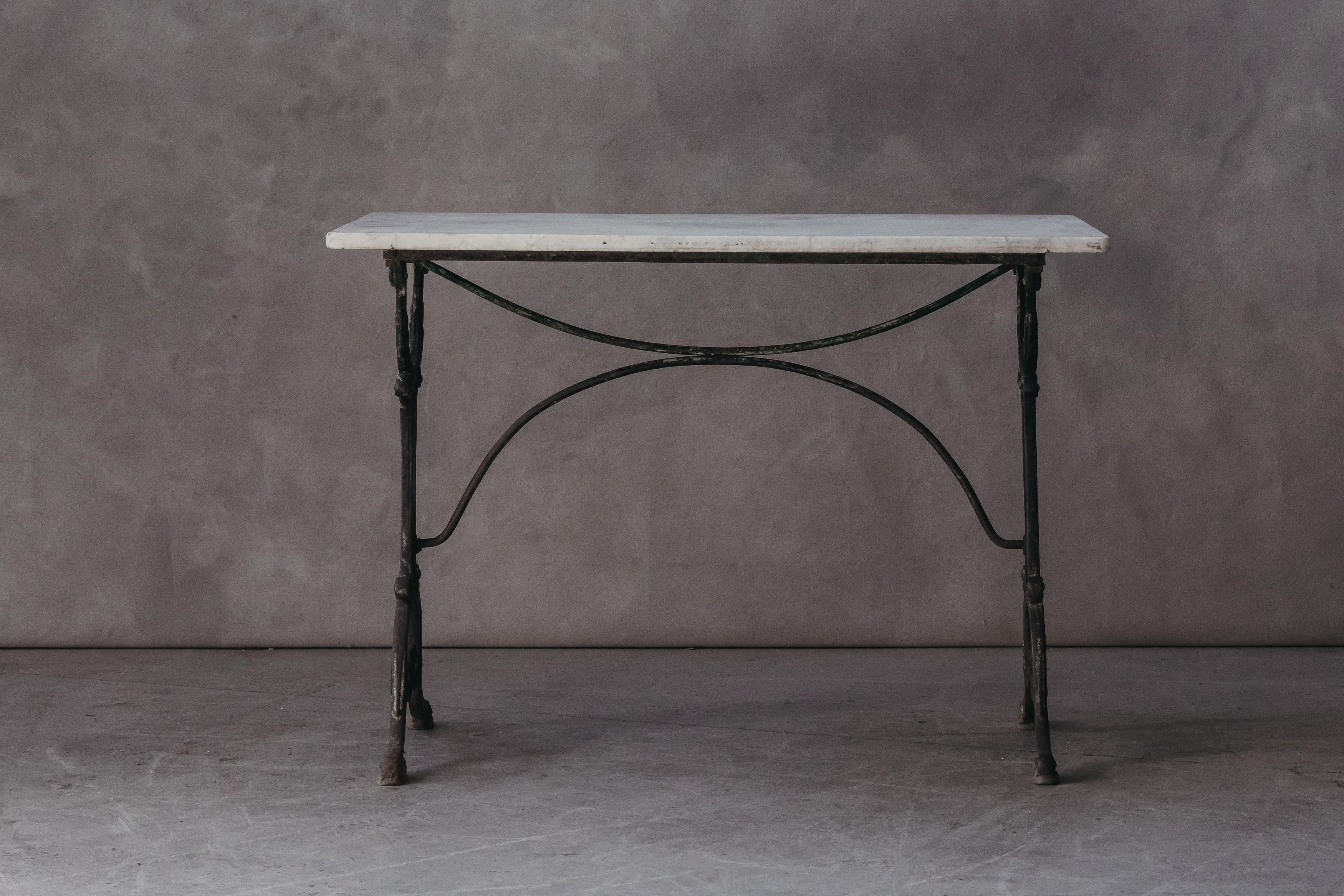 Vintage Marble Bistro Table From France, circa 1950. Original white marble top on anion base. Nice original patina.

We prefer to speak directly with our clients. So, If you have any questions or would like to know more please give us a call or