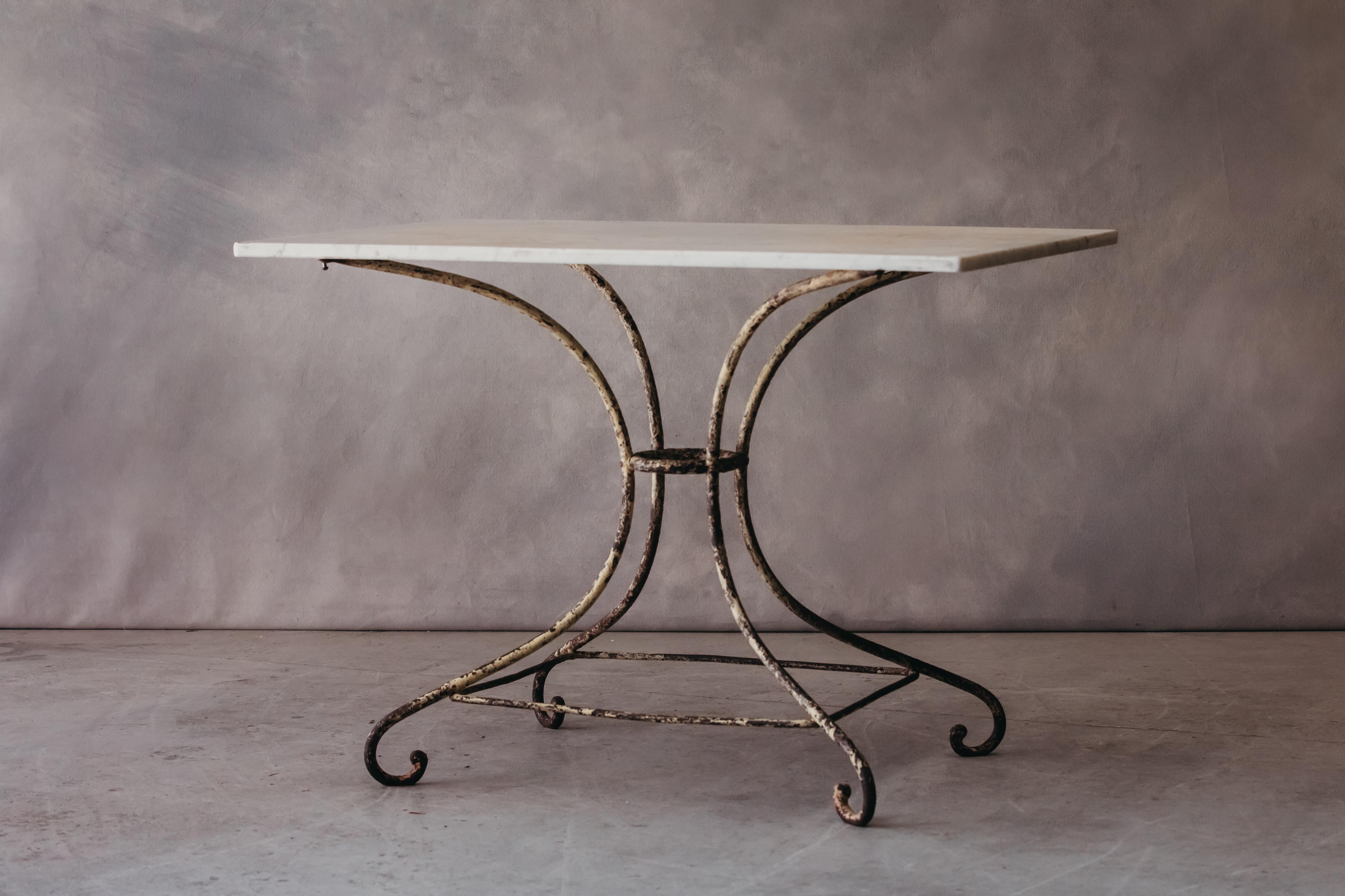 Vintage Marble Bistro Table From France, circa 1960. Elegant model with fantastic original color and patina.