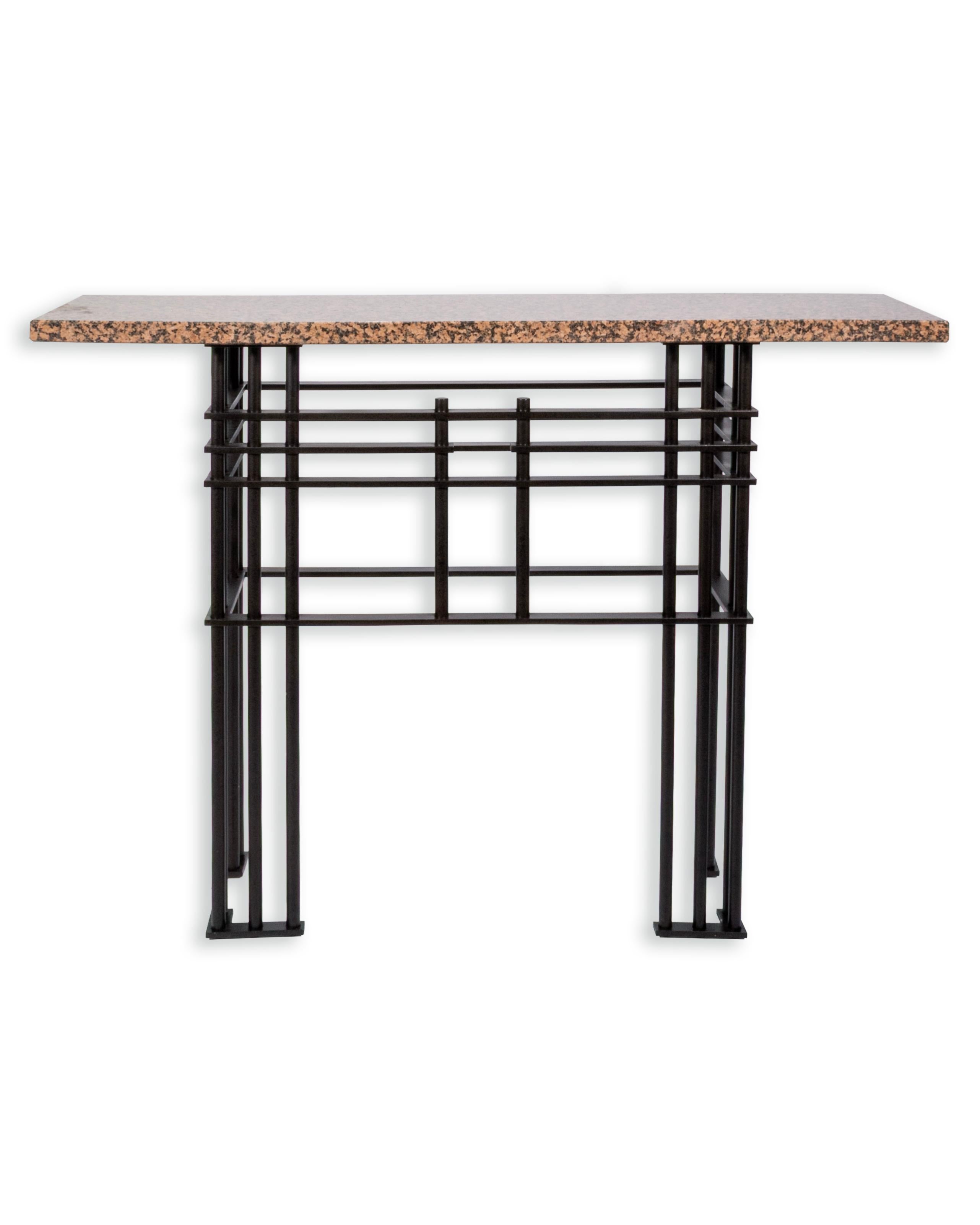 This striking console table, attributed to French designer Jean-Michel Wilmotte for Mirak, exemplifies a refined balance of materiality and structure. The piece features a polished marble top with warm, natural veining, supported by an architectural