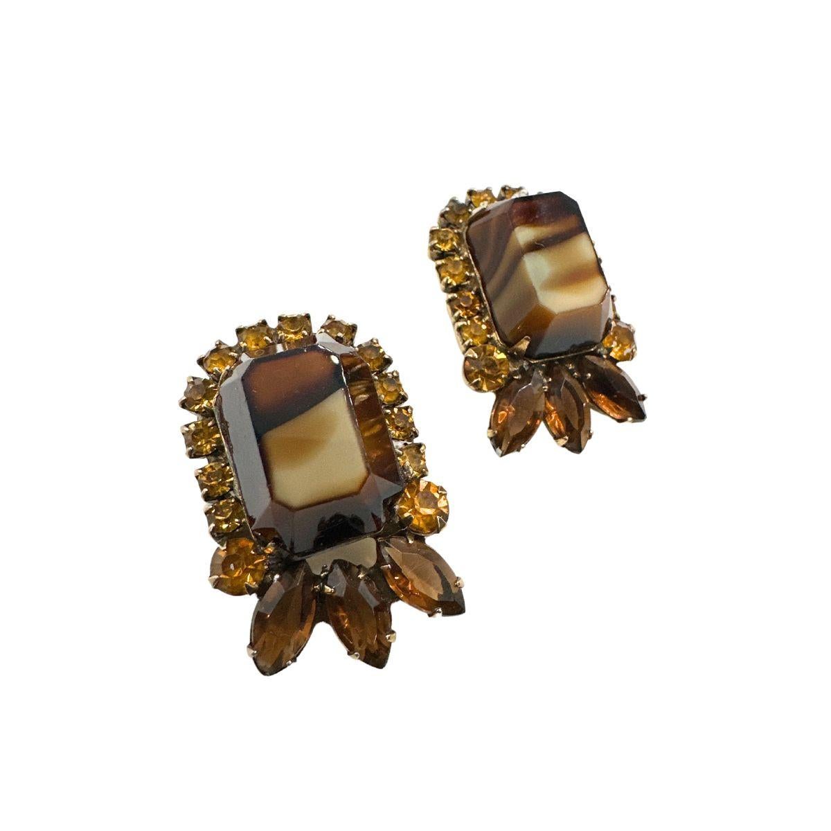 Introduce a touch of vintage glamour to your ensemble with these Vintage Marble Brown Glass and Champagne Color Rhinestone Clip-On Earrings. This exquisite pair combines the rich tones of marble brown glass with the subtle sparkle of