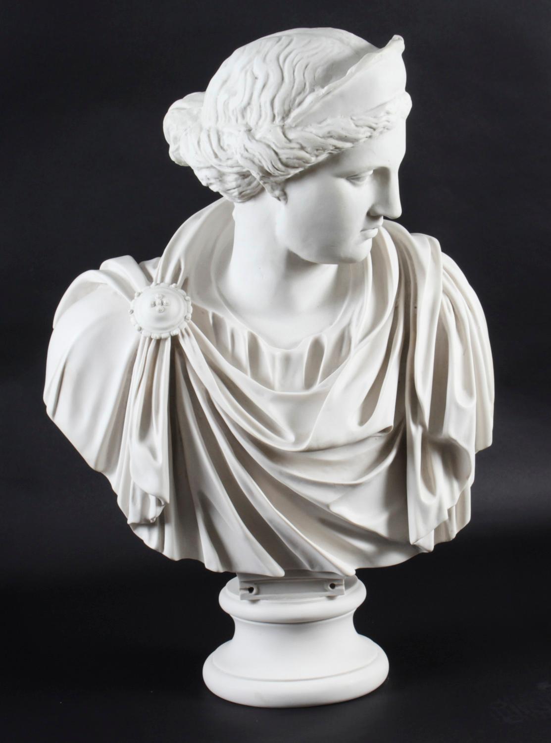 A beautifully sculpted marble bust of a Roman Goddess in a toga.

After the full size Roman marble copy which was after the ancient Greek statue depicting Diana the Huntress by Leochares.

The attention to detail throughout the piece is second