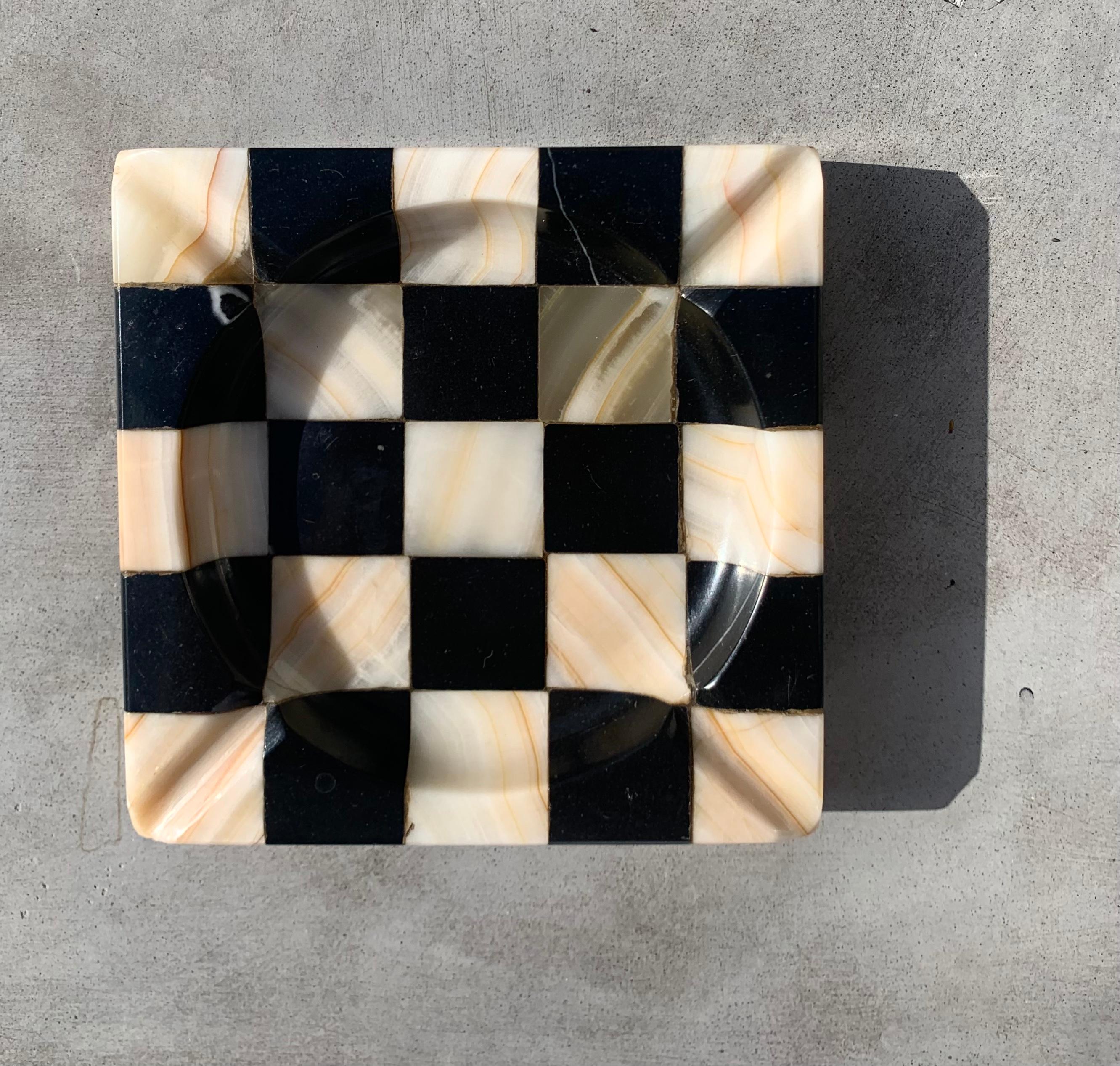 A vintage checkered onyx and marble ashtray. Works well as a catchall as well. Four rivulets line each corner. Fabulous condition. Heavy. Most likely hailing from 1960s Italy.