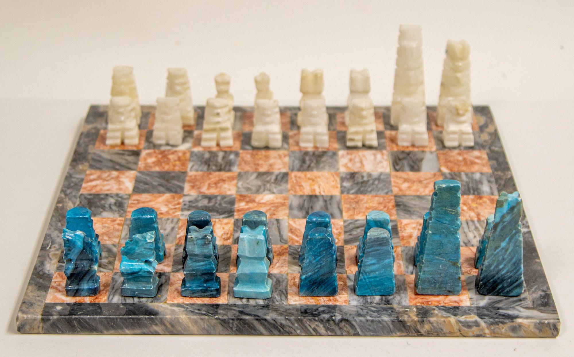 Vintage Marble Large Chess Set with hand carved Turquoise and White Onyx Pieces. 1950s.
Vintage mid 20th century Mexican stone marble chess set complete chess board in white and black and grey marble stone with elaborately hand carved turquoise and