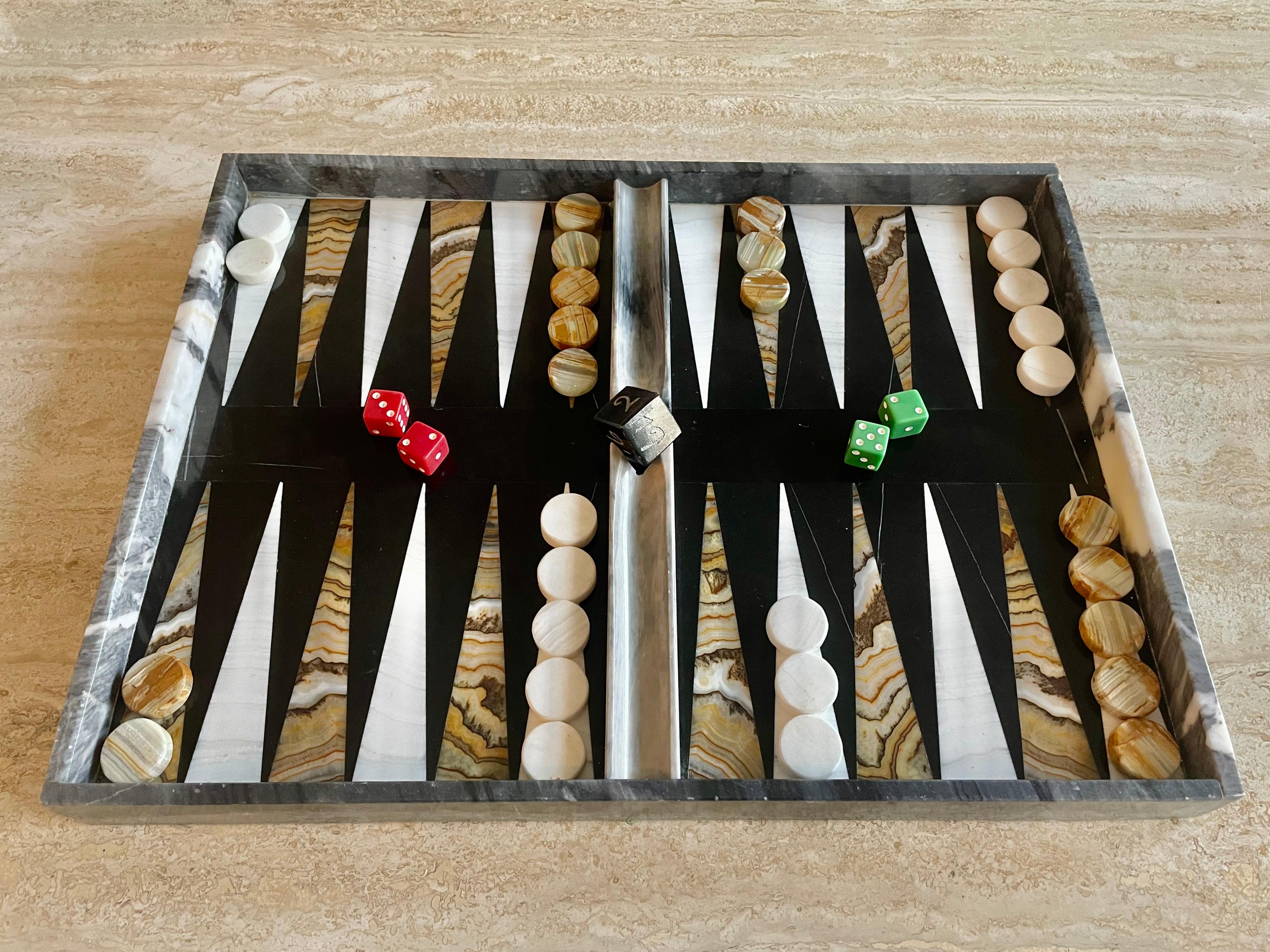 Midcentury marble backgammon board with game pieces and dice.