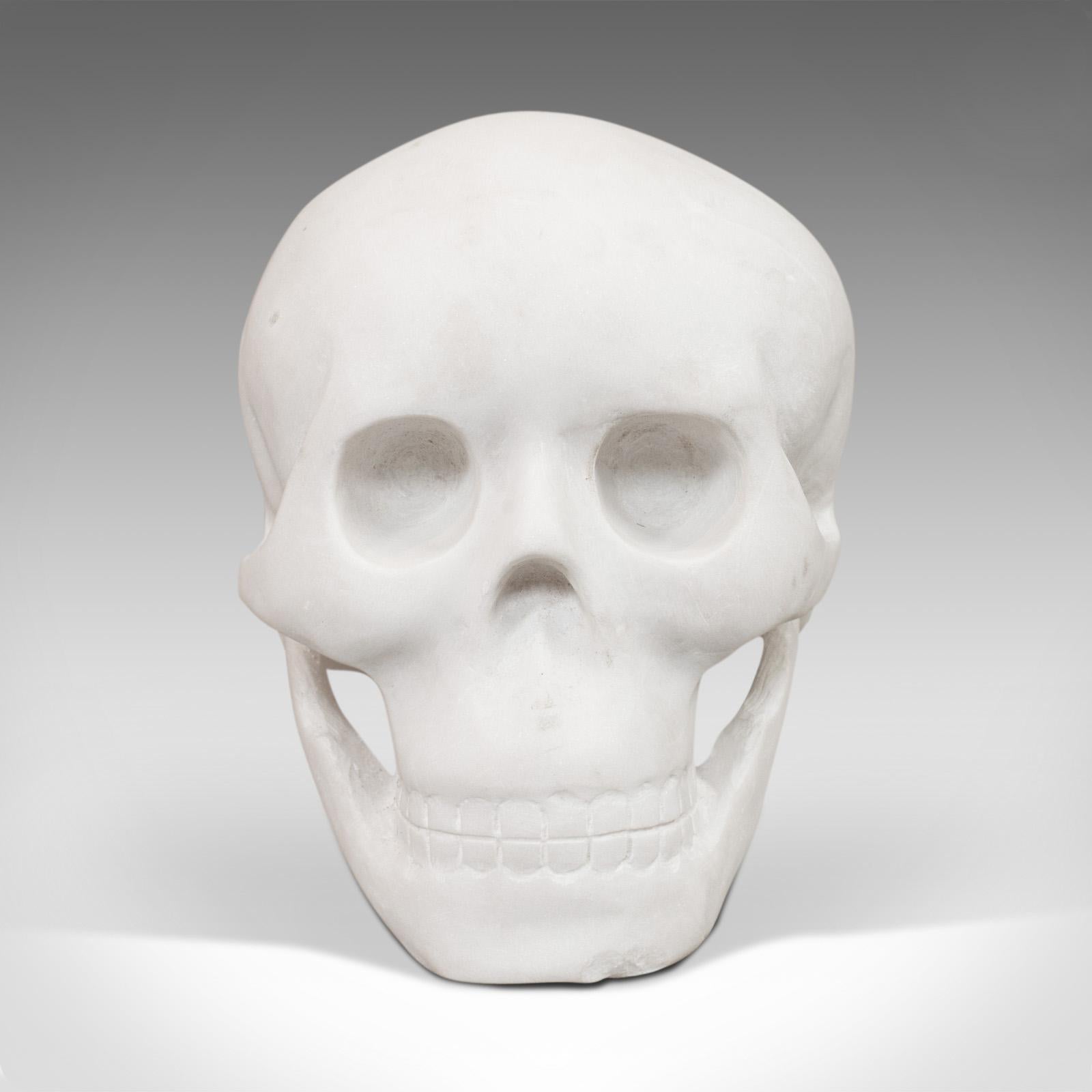 This is a vintage marble skull. An English, Bianco assoluto paperweight or ornamental study, dating to the late 20th century.

Add some macabre to your desk or bookcase
Displays a desirable aged patina - some marks visible under closer