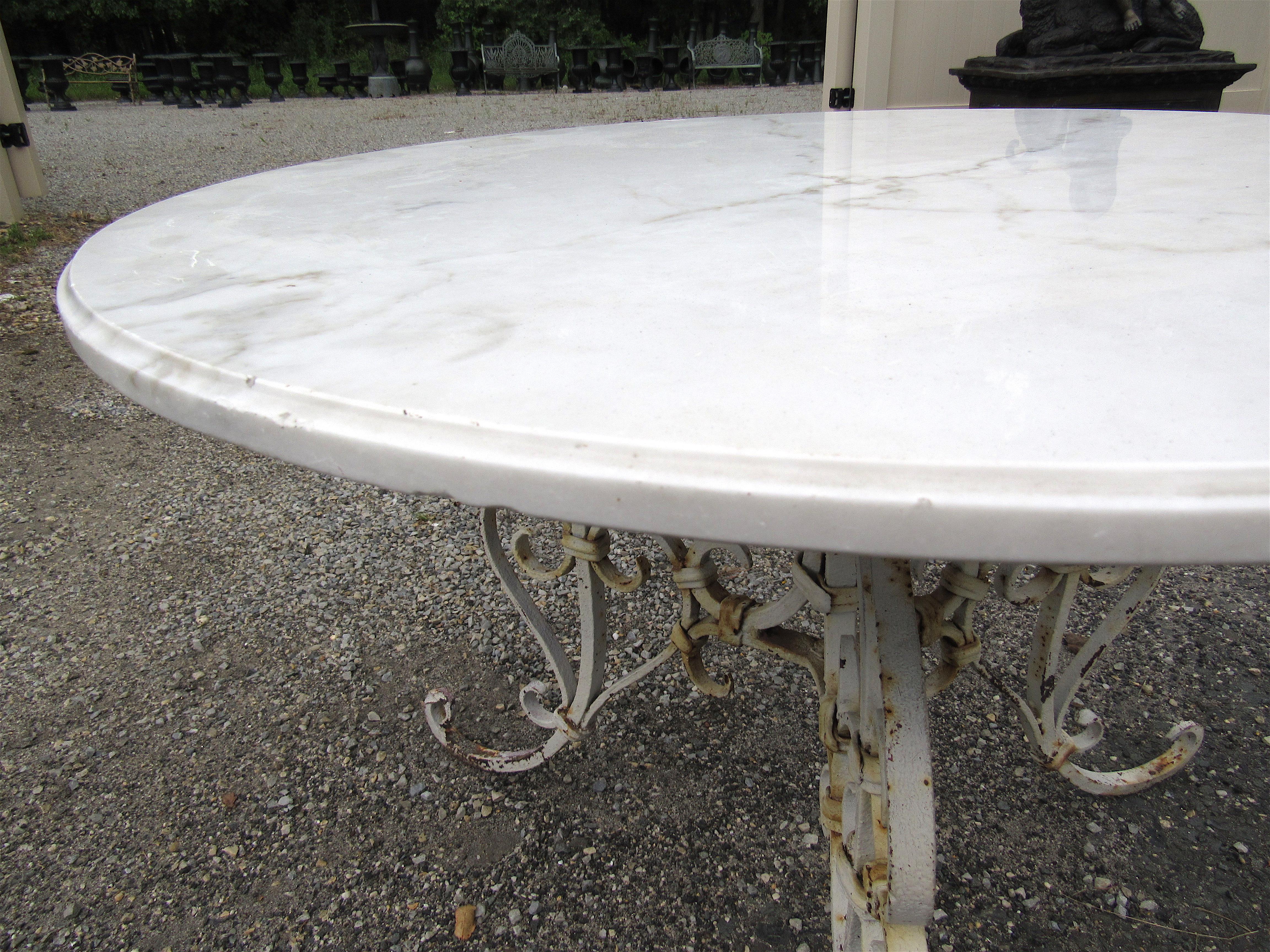 Impressive vintage marble-top patio table. Stylish ornate iron base. This table would make an excellent addition to any patio/outdoor area's decor. Please confirm item location with dealer (NJ or NY).