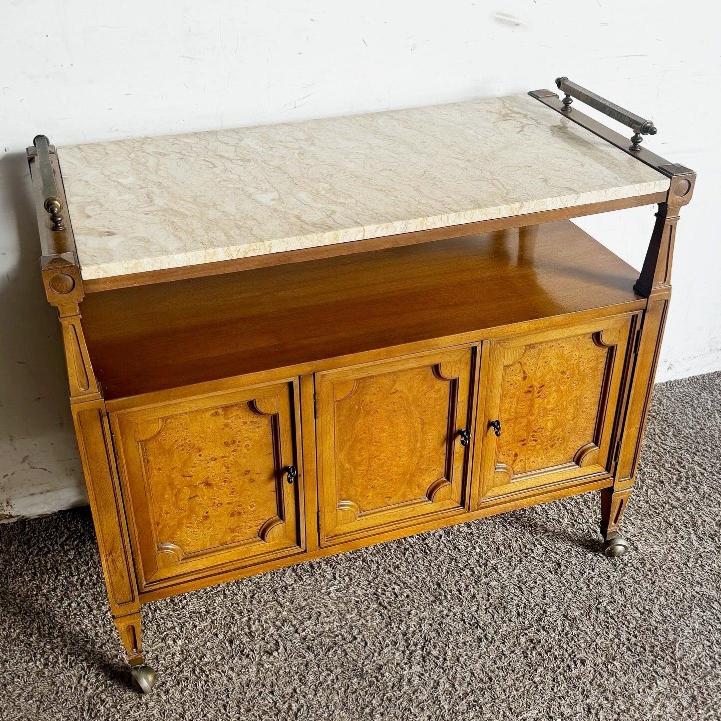 Discover the Vintage Marble Top Wooden Service Cart with Burl Doors, offering elegance and functionality for your entertaining needs.
 
 Wear around the edges of the wood as shown in the photos, and minor scratches to the marble as shown. 
 
 We