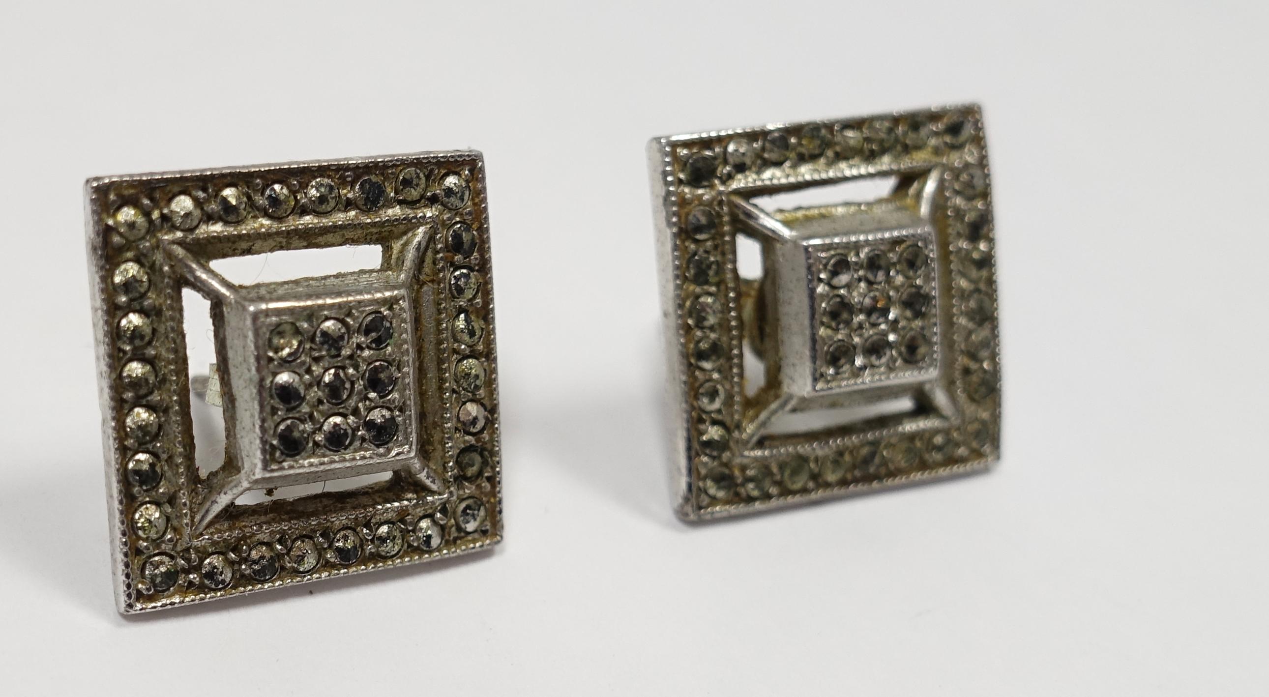 These vintage earrings feature marcasites in a square 3 dimension design in sterling.  These pierce earrings have posts and measure 3/4” and are in excellent condition.