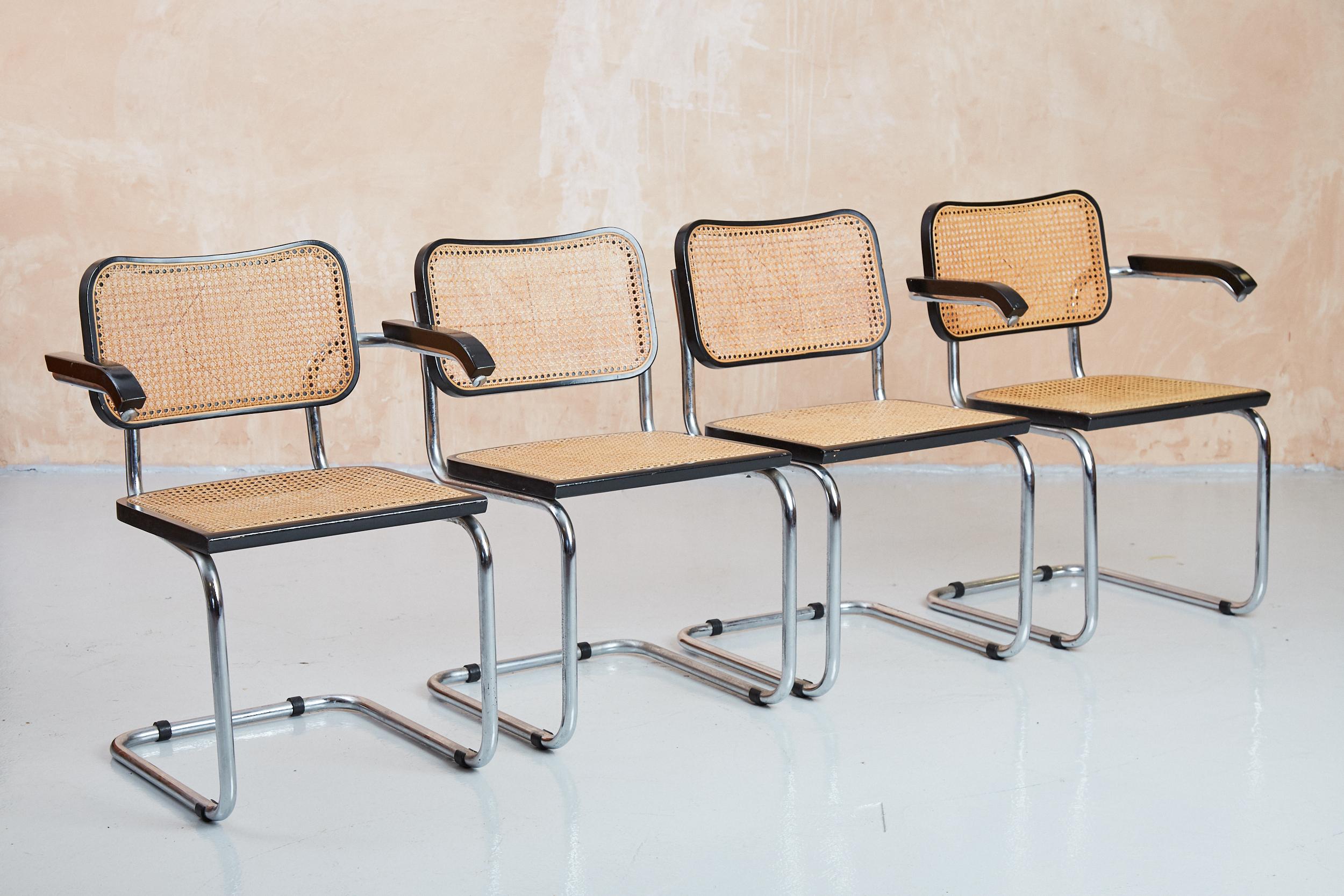 Set of 4 vintage Marcel Breuer designed Cesca chairs produced under licence by Habitat in the 1980s. Iconic design classic which adapts to a multitude of interior design styles. This set includes two regular dining chairs and two carver dining
