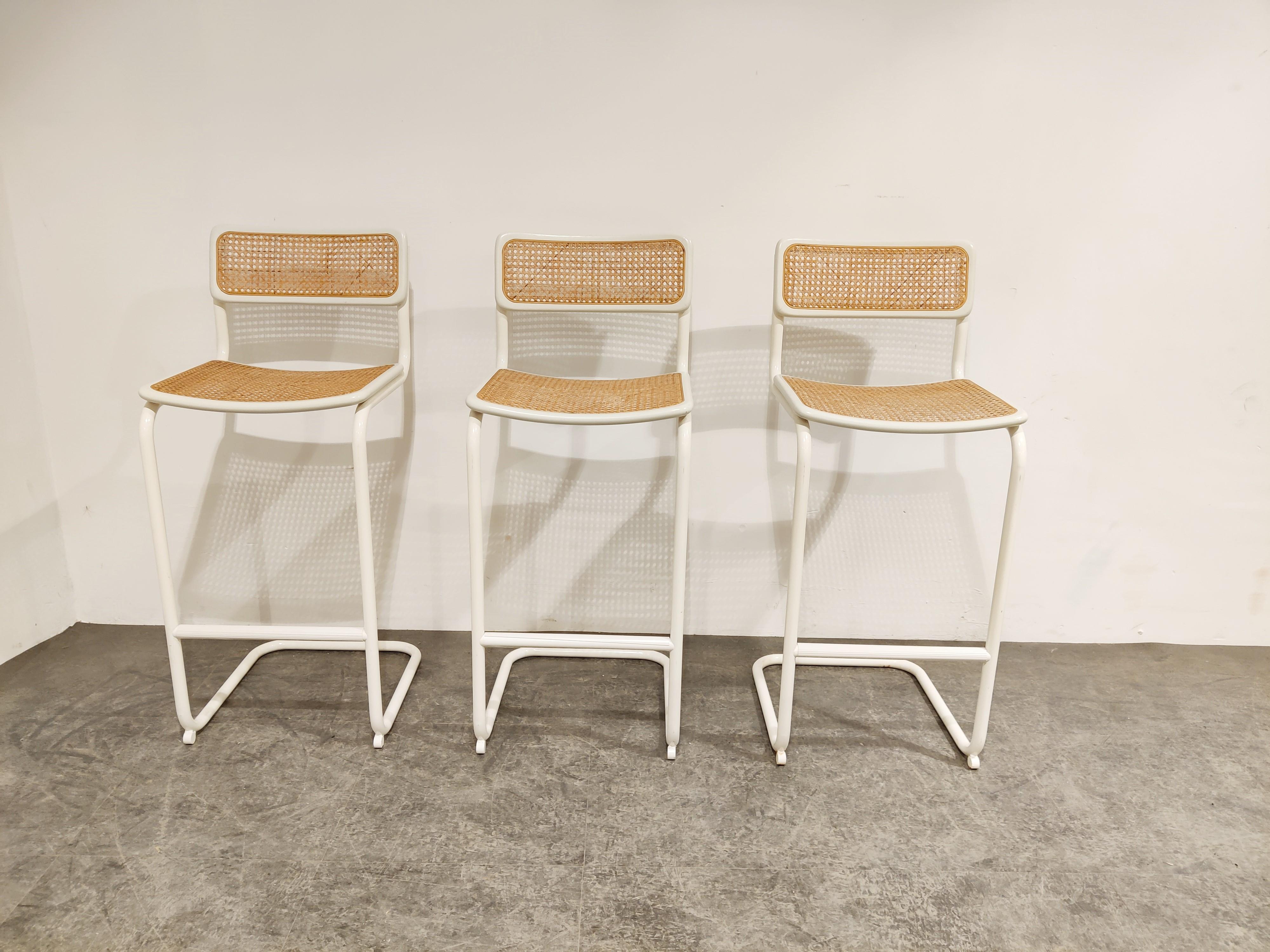 Set of 3 Marcel Breuer bauhaus design bar stools.

Tubular lacquered metal frames with cane seats.

All in good originaml condition.

Dimensions:
Height: 93cm/36.61