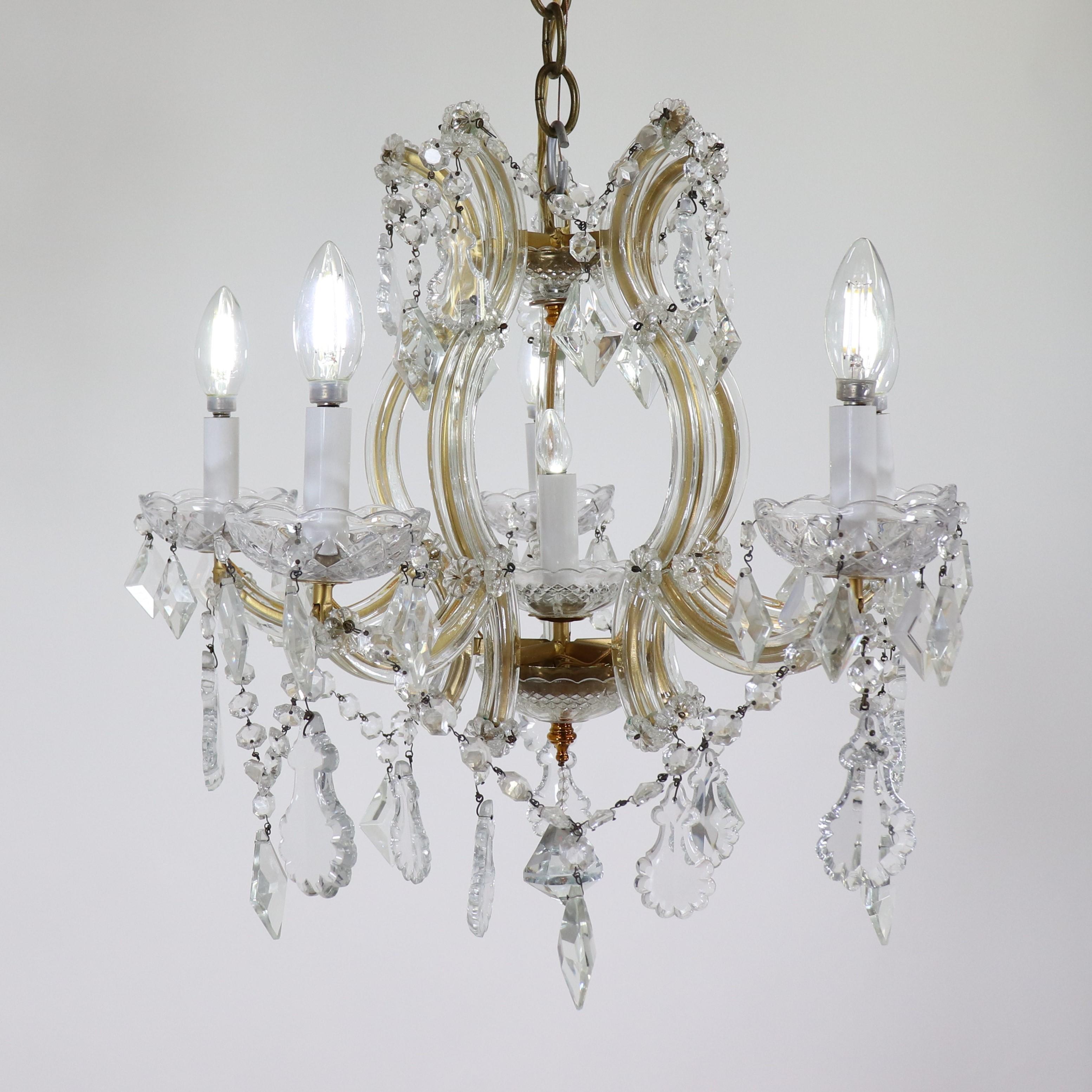 This type of chandelier is identified and named after the 18th century Empress of Austria, who in the late 18th Century had her palace filled with these Bohemian crystal chandeliers. This small-scale early twentieth-century Maria Theresa-style