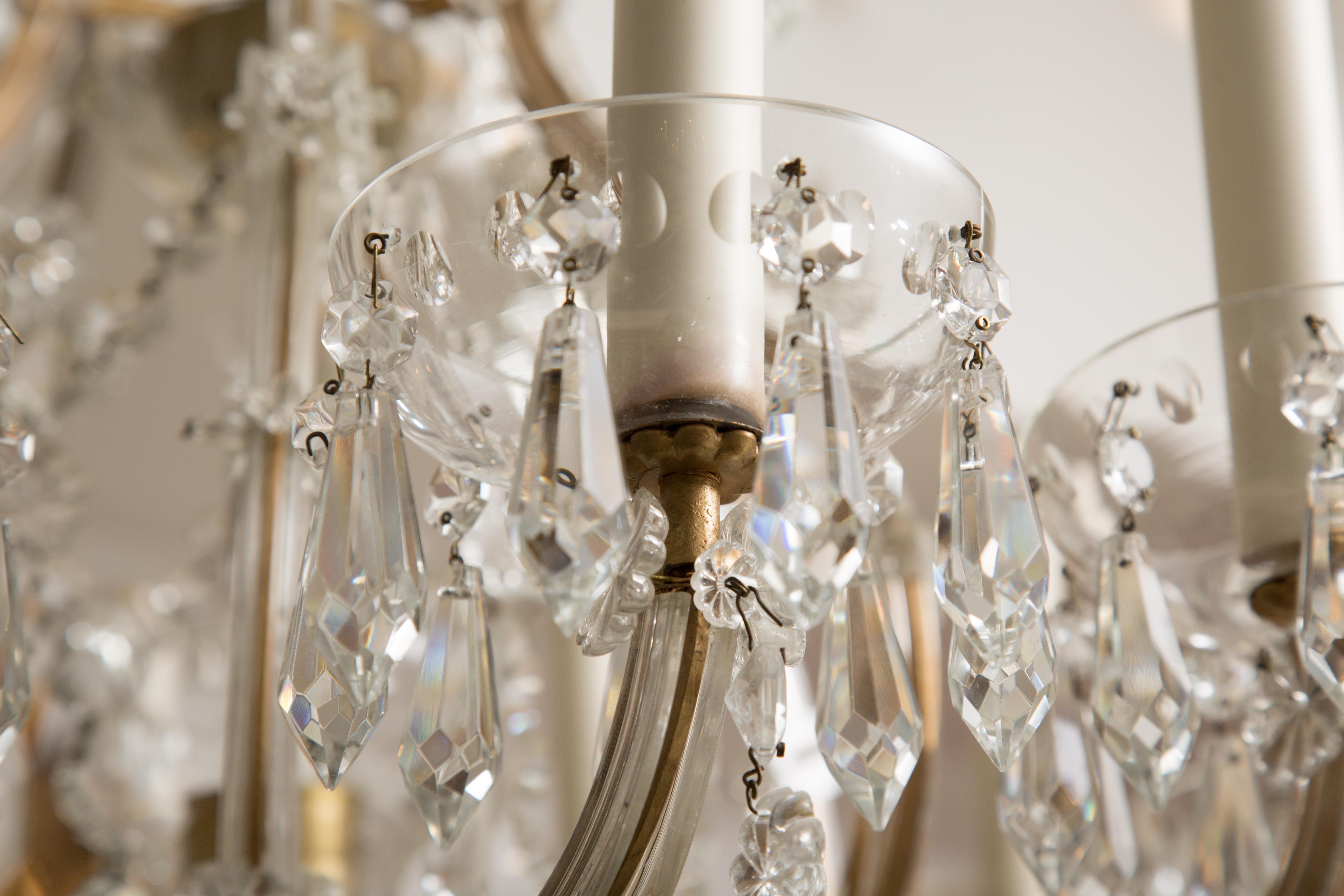 This is a Classic Maria Theresa twelve-light crystal chandelier, circa 1930.