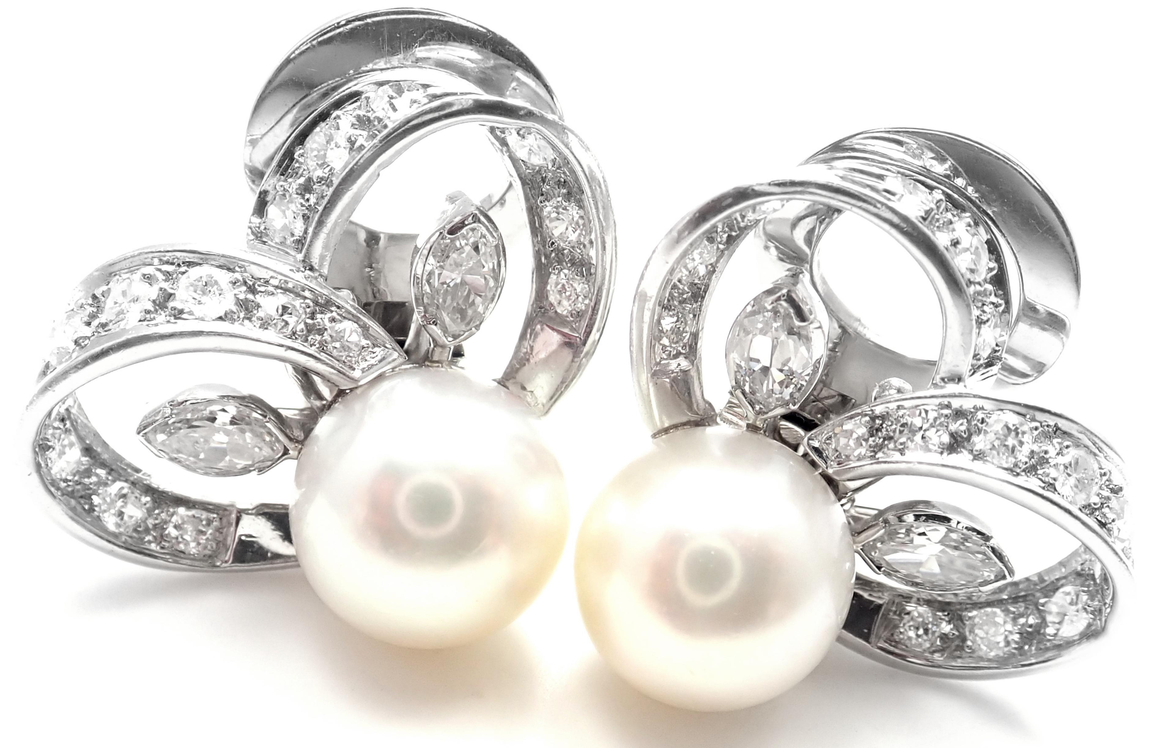 Platinum Diamond Pearl Vintage Earrings by Marianne Ostier. 
With 28 round brilliant cut diamonds VS1 clarity, G color 
4 marque shape diamonds VS1 clarity, G color
Total weight of diamonds approx. 1.20ct
2 Cultured Pearls 10mm each.
These earrings
