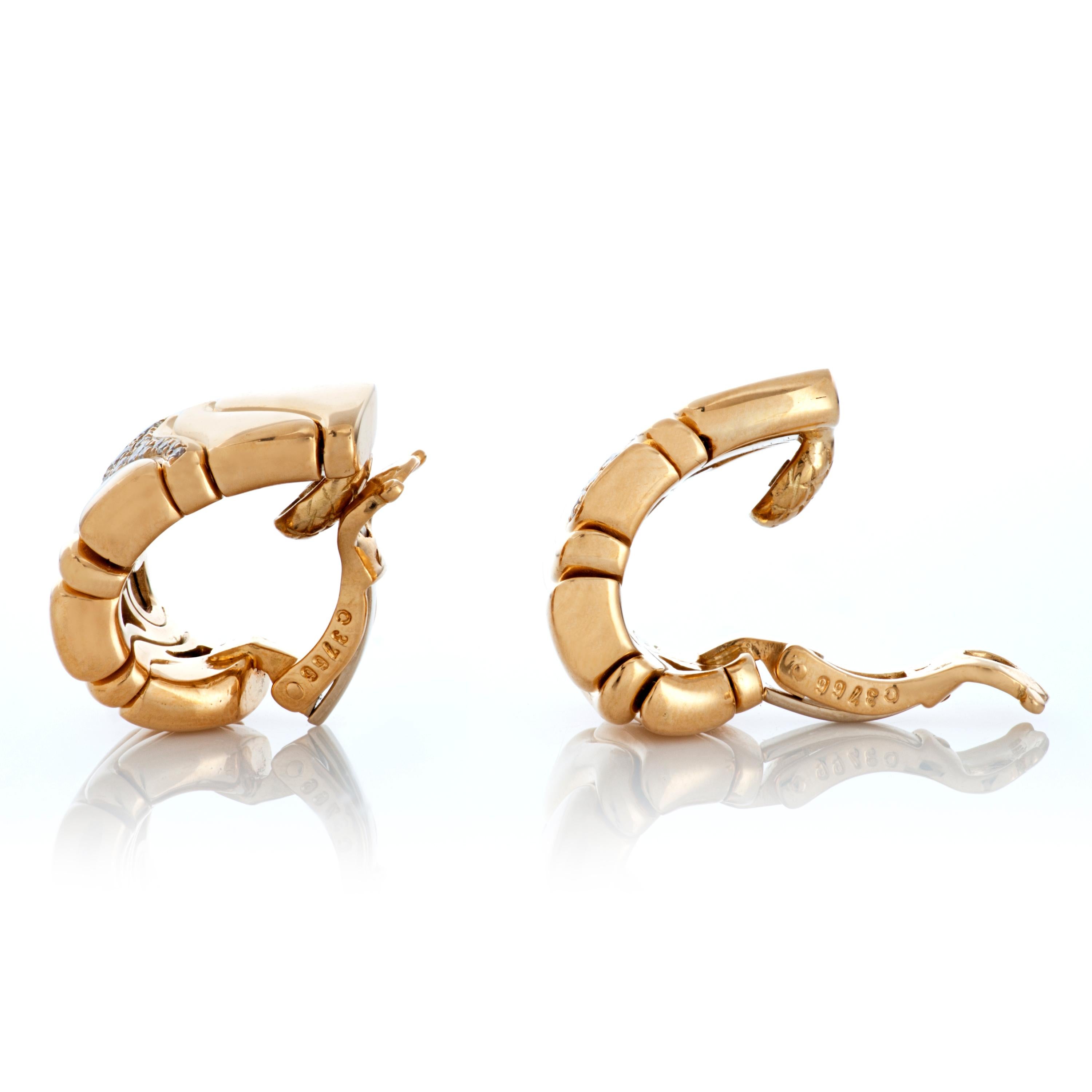 Vintage Marina B. huggie style diamond ear clips in 18k yellow gold.

These earrings feature 30 round brilliant cut diamonds totaling approximately 0.50 carats with F-G color and VS clarity.  45.8 grams.  

They measure approximately 0.50