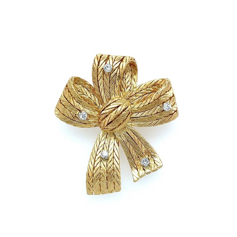 Simply Beautiful! Stylish and finely detailed Vintage Designer Mario Buccellati Signed Diamond Brushed Gold Bow Brooch. Securely hand set with Diamonds, weighing approx. 0.20tcw. Measuring approx. 44mm. Hand crafted in 18K Yellow Gold. The Pin is in