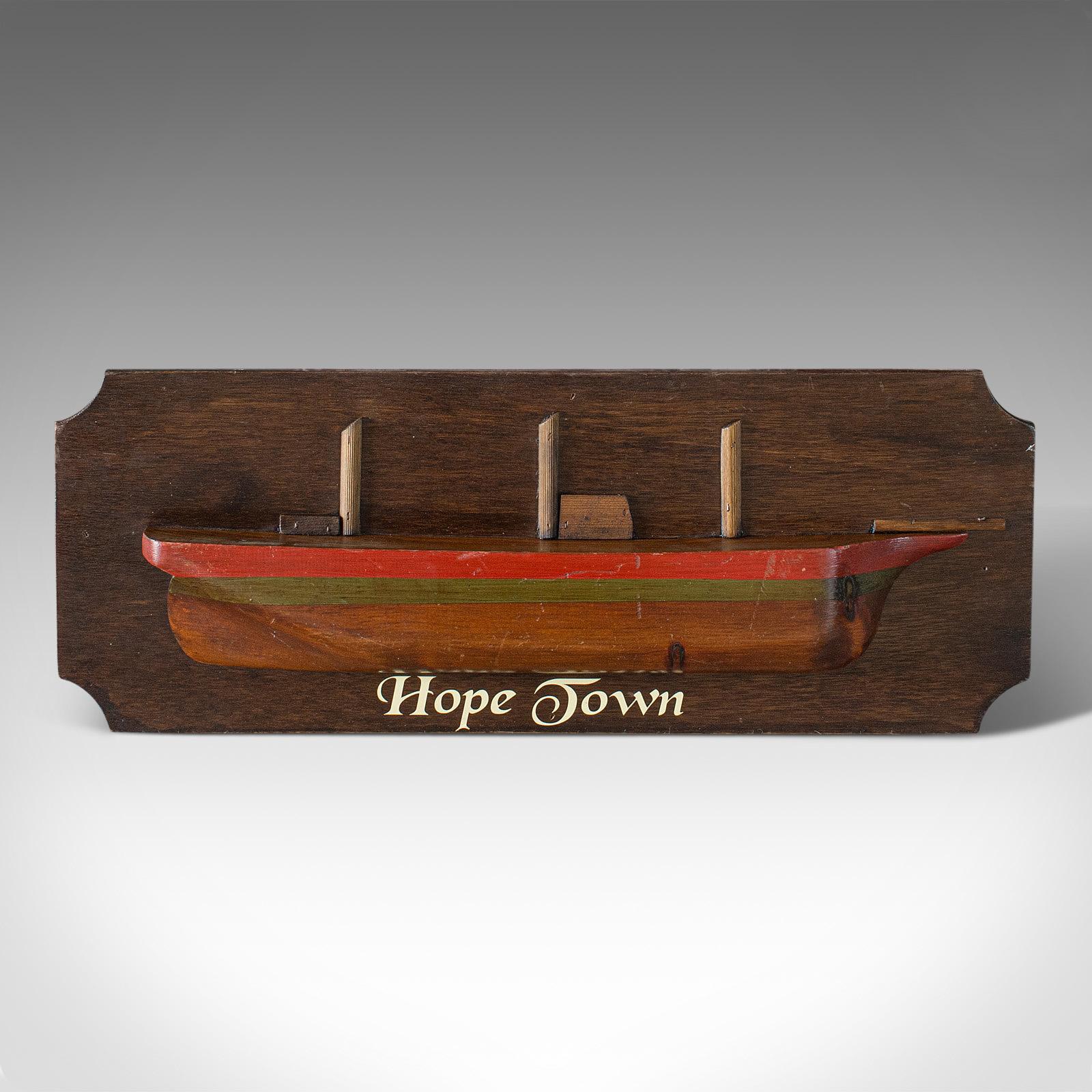This is a vintage maritime half hull. An English, pine decorative ship plaque, dating to the early 20th century, circa 1930.

Appealing maritime collectible
Displays a desirable aged patina
Pine shows fine grain interest

Hull finished with